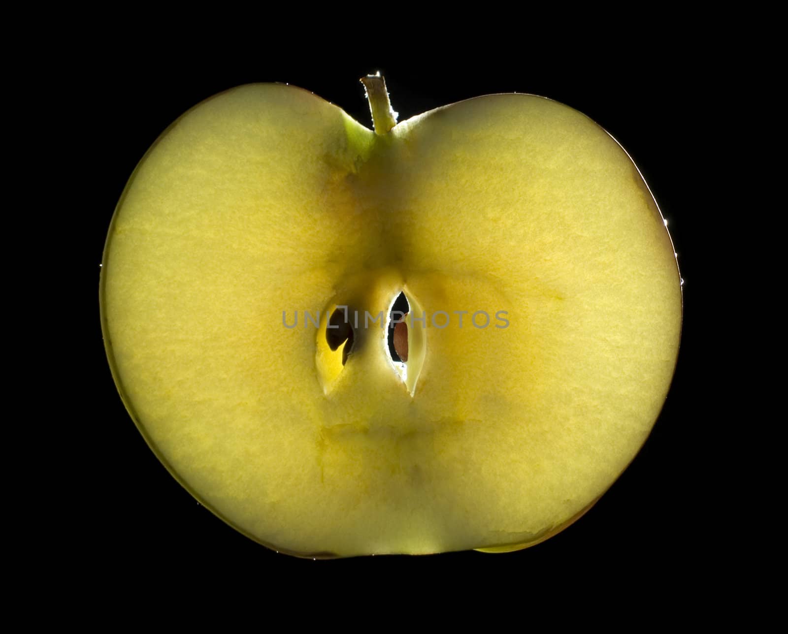 luminous apple on black background