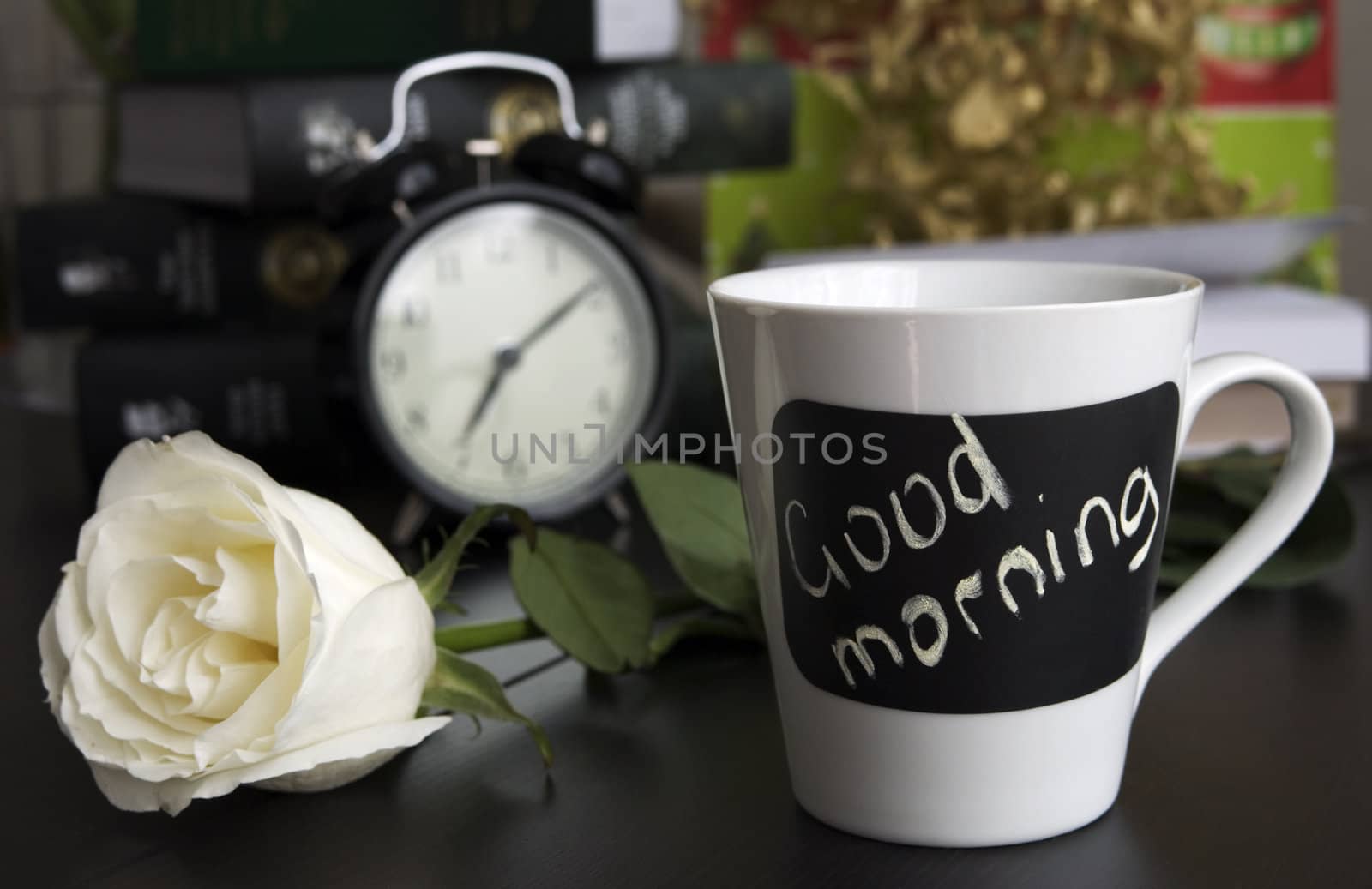 Cup of tea with rose on table