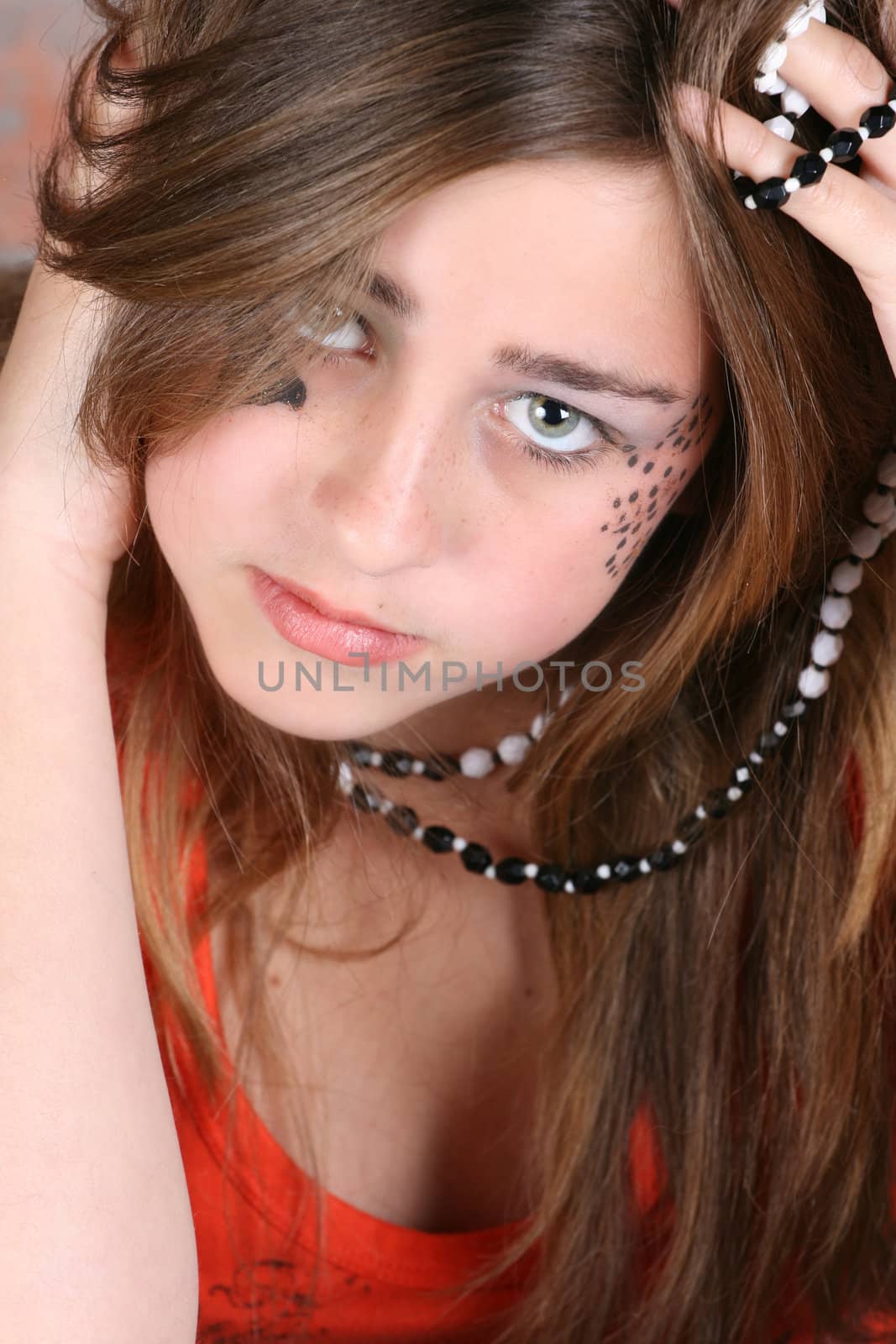 Teenage girl with face paint and fashionable jewellery
Beautiful teenage female with an angelic face