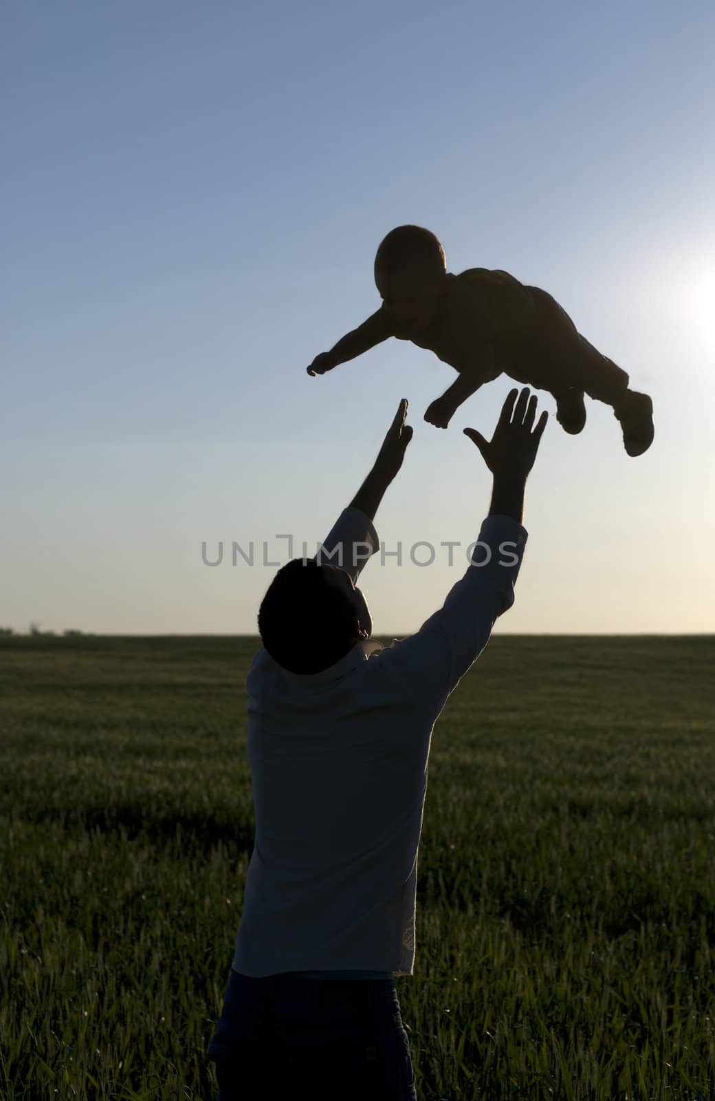 Young man play with son