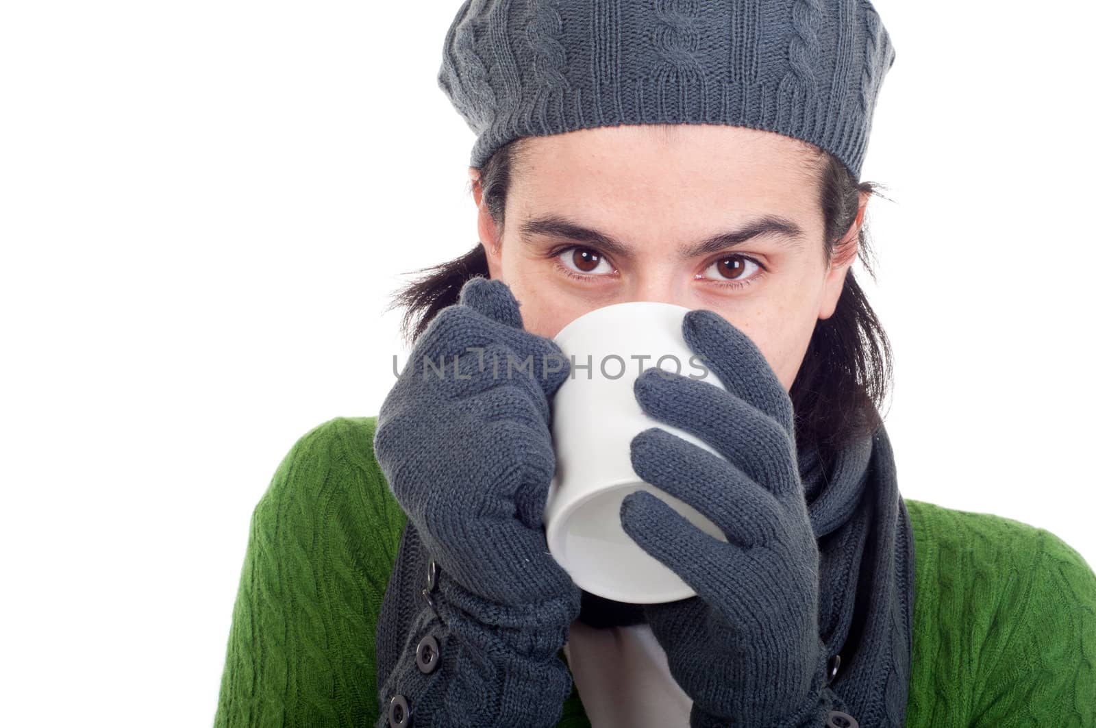 close up of a winter woman drinking hot coffee/tea (isolated on white background)