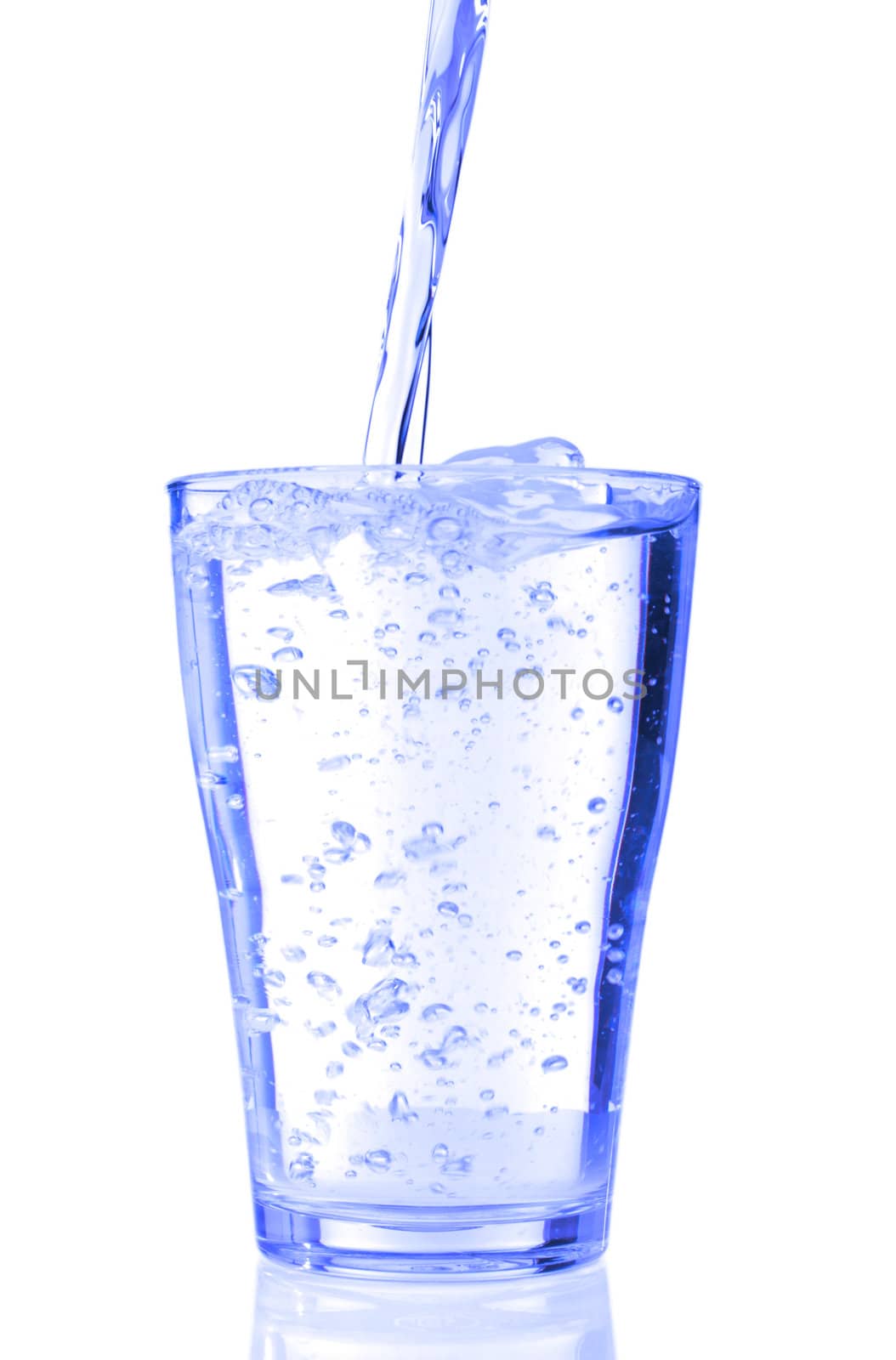 fresh water pouring into a glass isolated on white background