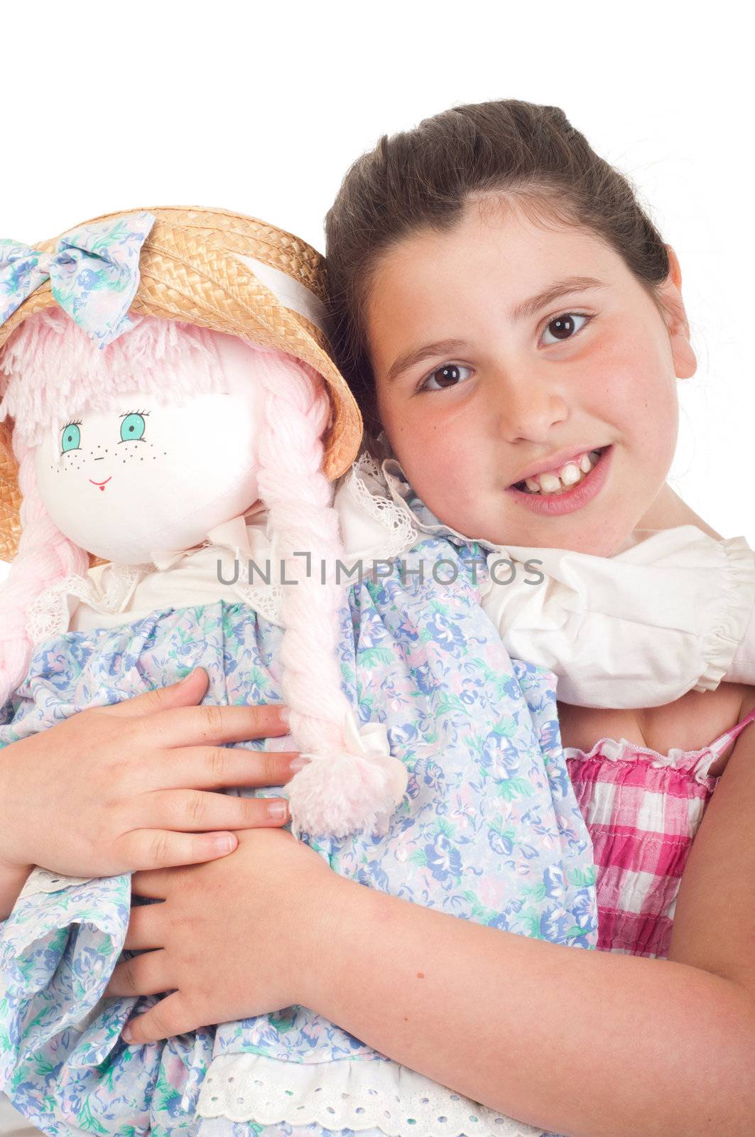 joyful little girl with her favorite doll (isolated on white background) 