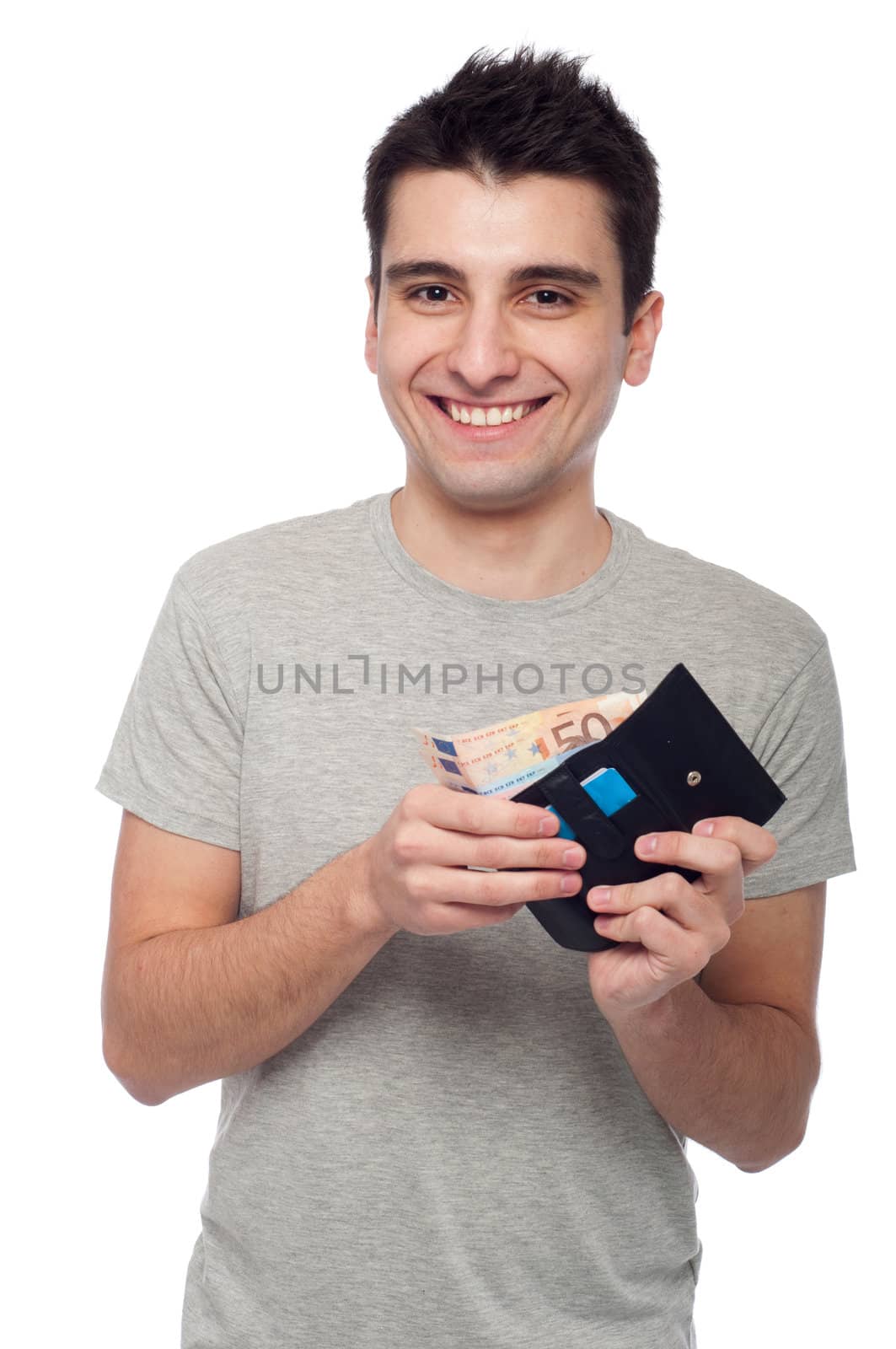 smiling young man showing his wallet with money and cards (isolated on white background)