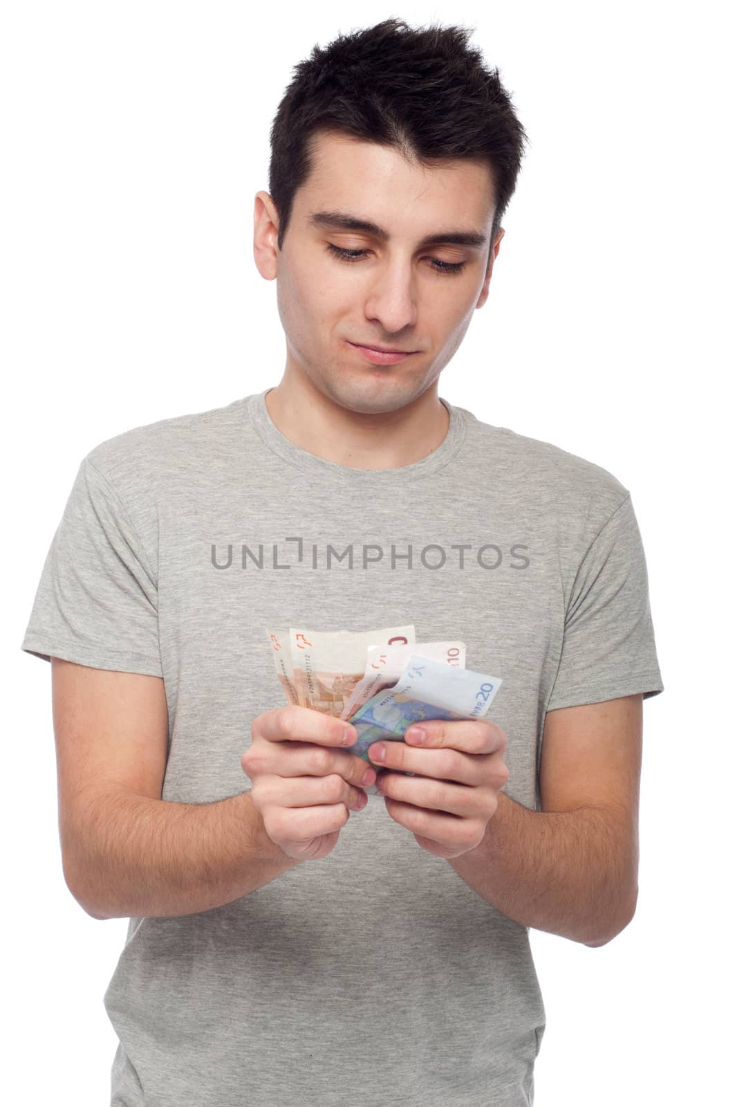 quiet young man looking at his money, euro bills (isolated on white background)