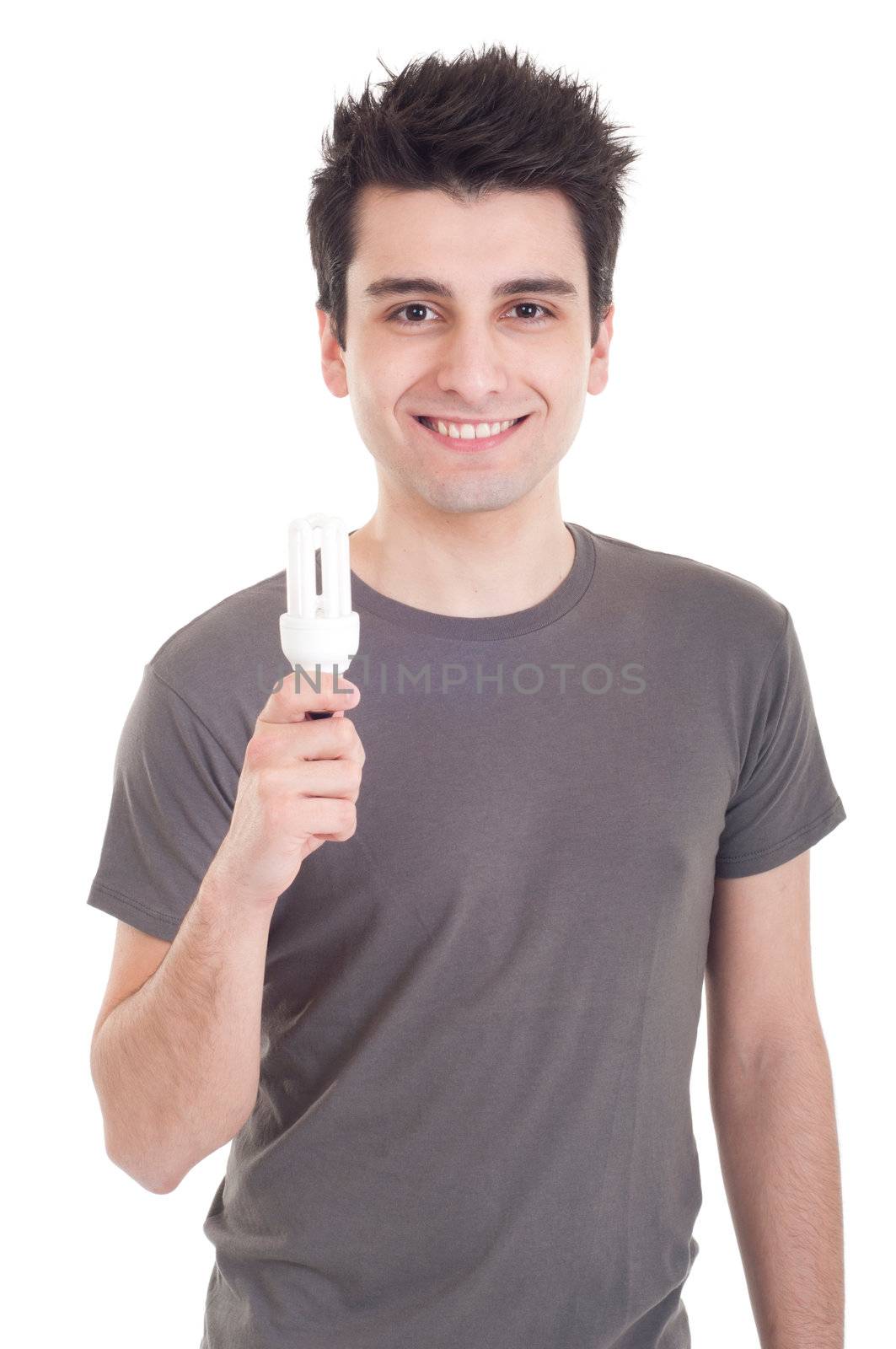 smiling casual man holding a energy-saving lightbulb isolated on white background