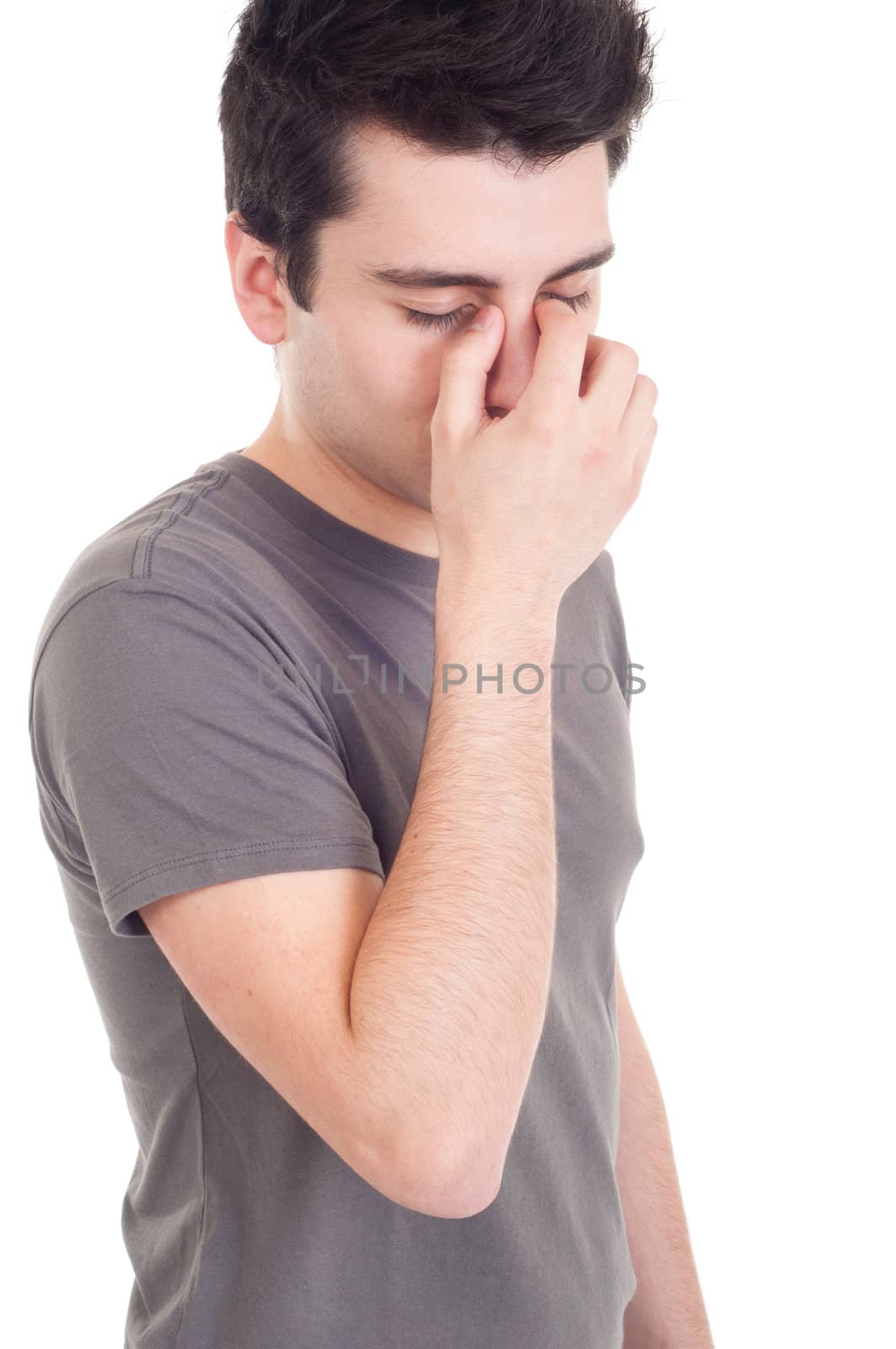 young sad man portrait expression isolated on white background (emotional or financial issue)