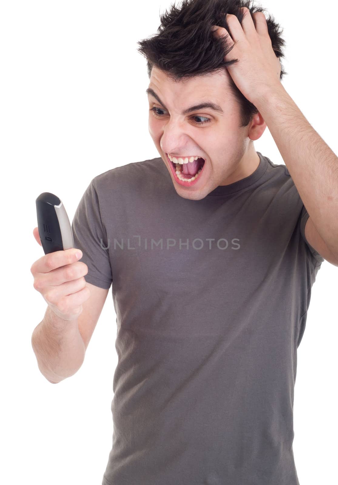 angry young man yelling at mobile phone isolated on white background