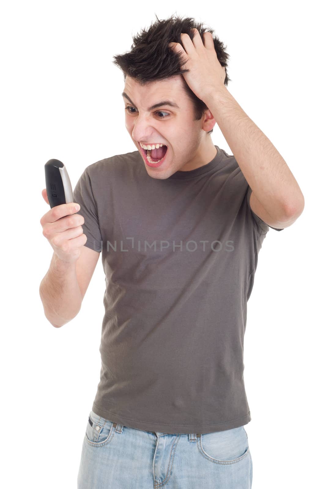 angry young man yelling at mobile phone isolated on white background