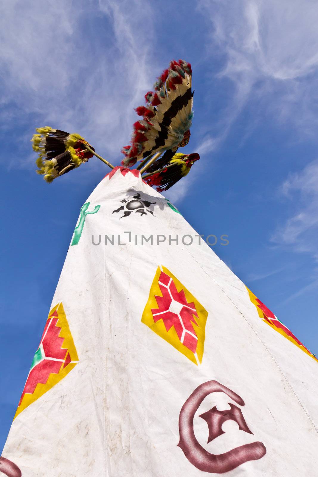 A pair of Native American tee pee and skyline