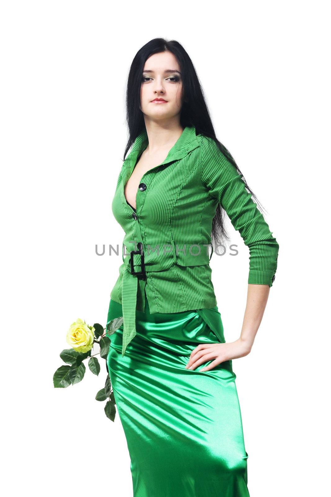 Young beautiful girl in green with a yellow rose on tne white background
