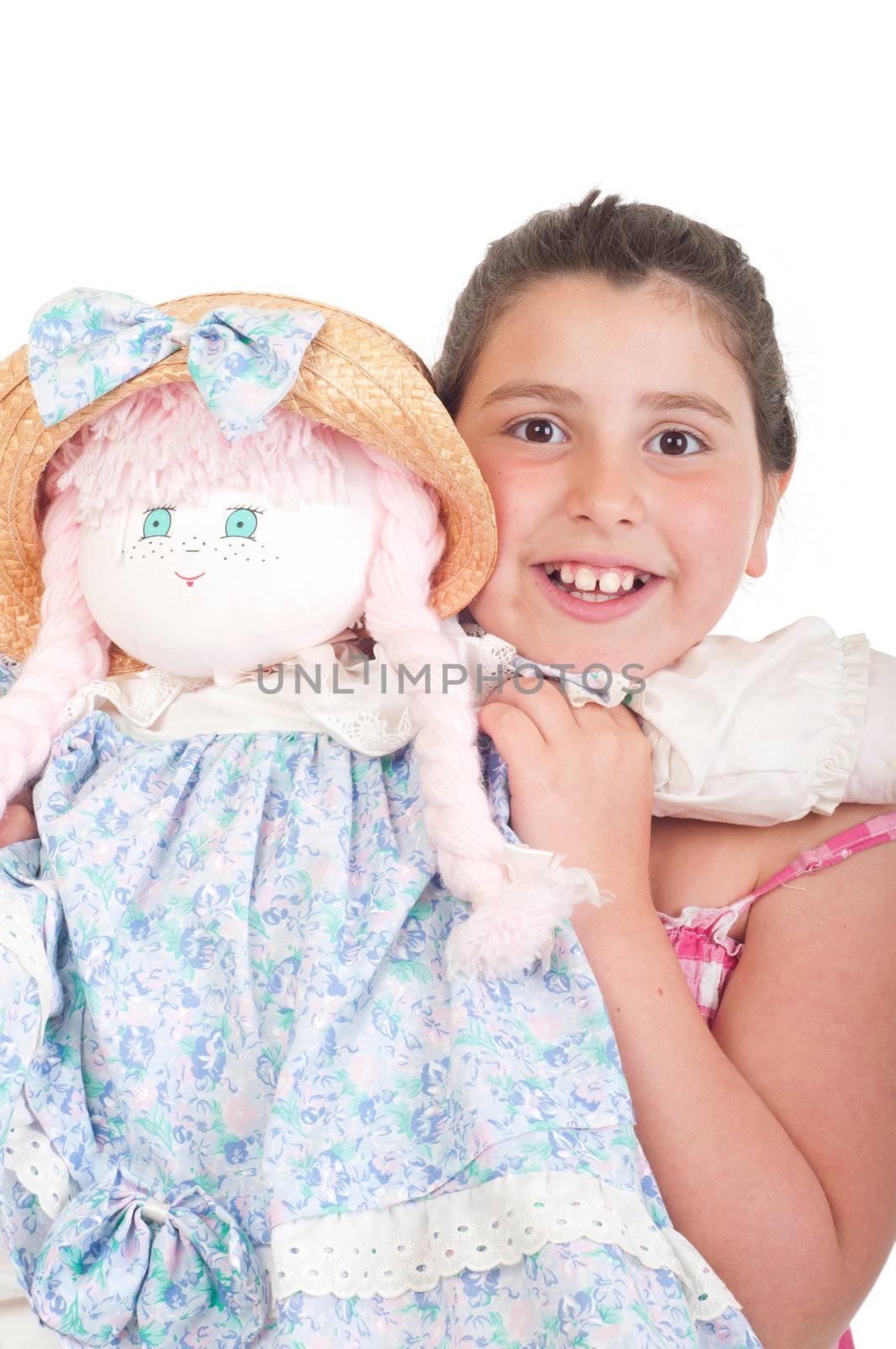 joyful little girl with her favorite doll (isolated on white background) 