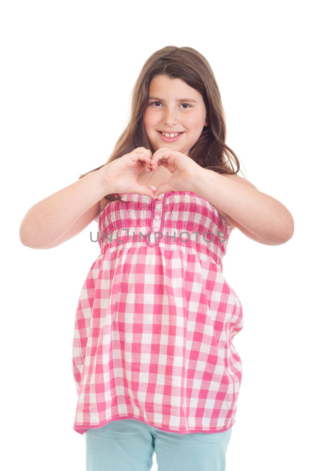 beautiful and smiling little girl showing heart symbol in a pink top (isolated on white background)