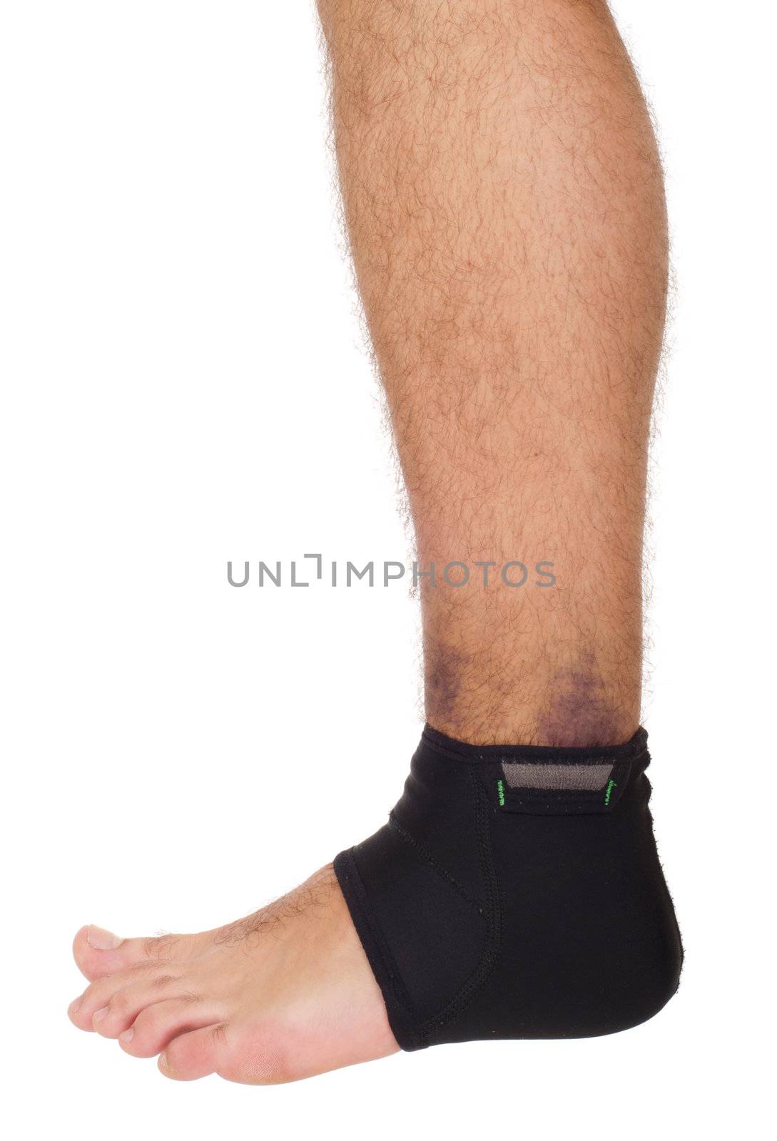 young male with ankle support to treat a sprain (isolated on white background)