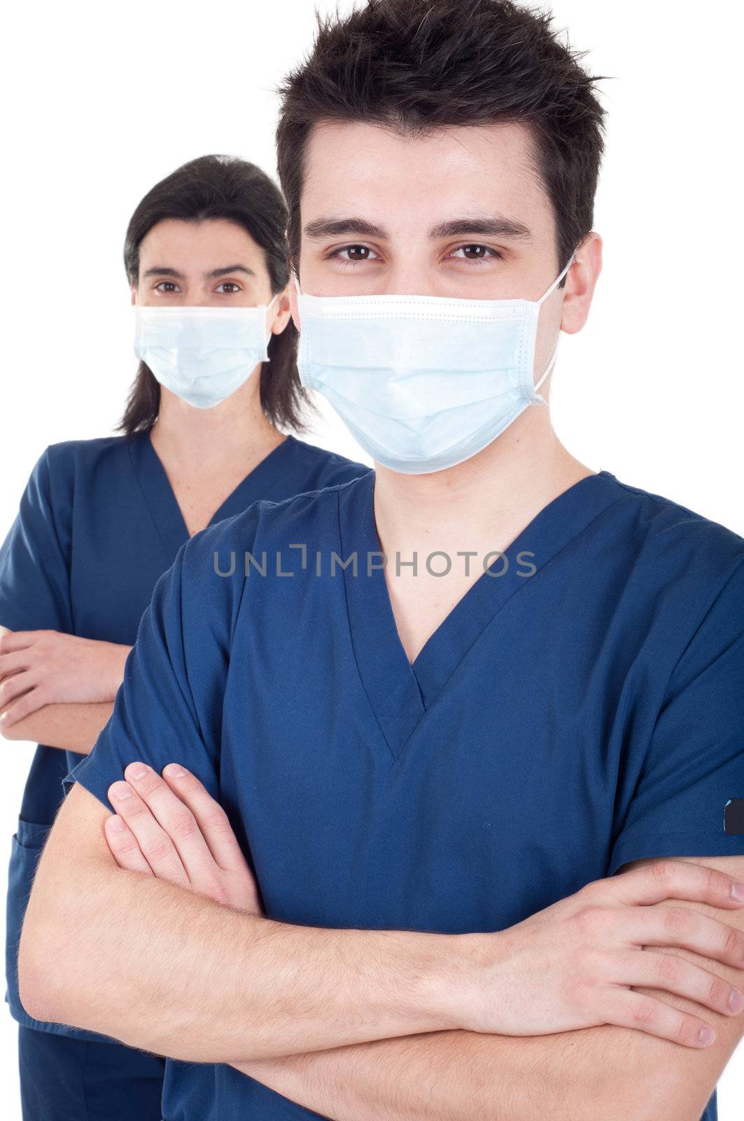 portrait of a team of doctors, man and woman wearing mask and uniform isolated on white background (selective focus)