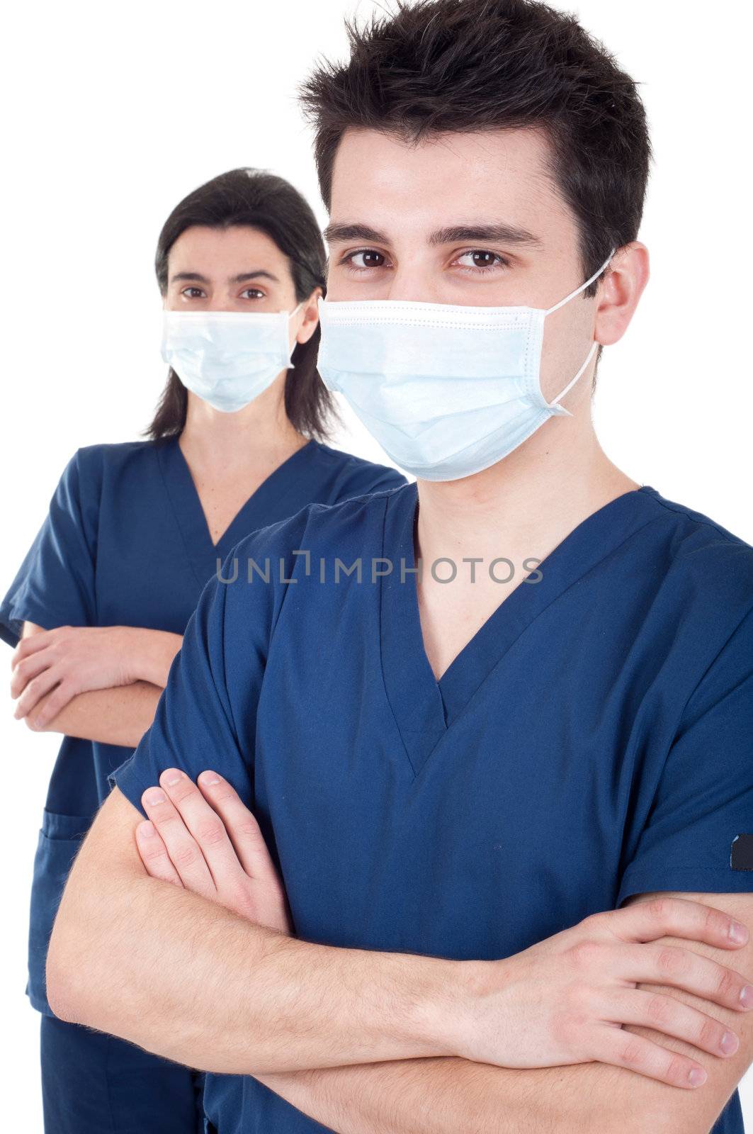 portrait of a team of doctors, man and woman wearing mask and uniform isolated on white background (selective focus)