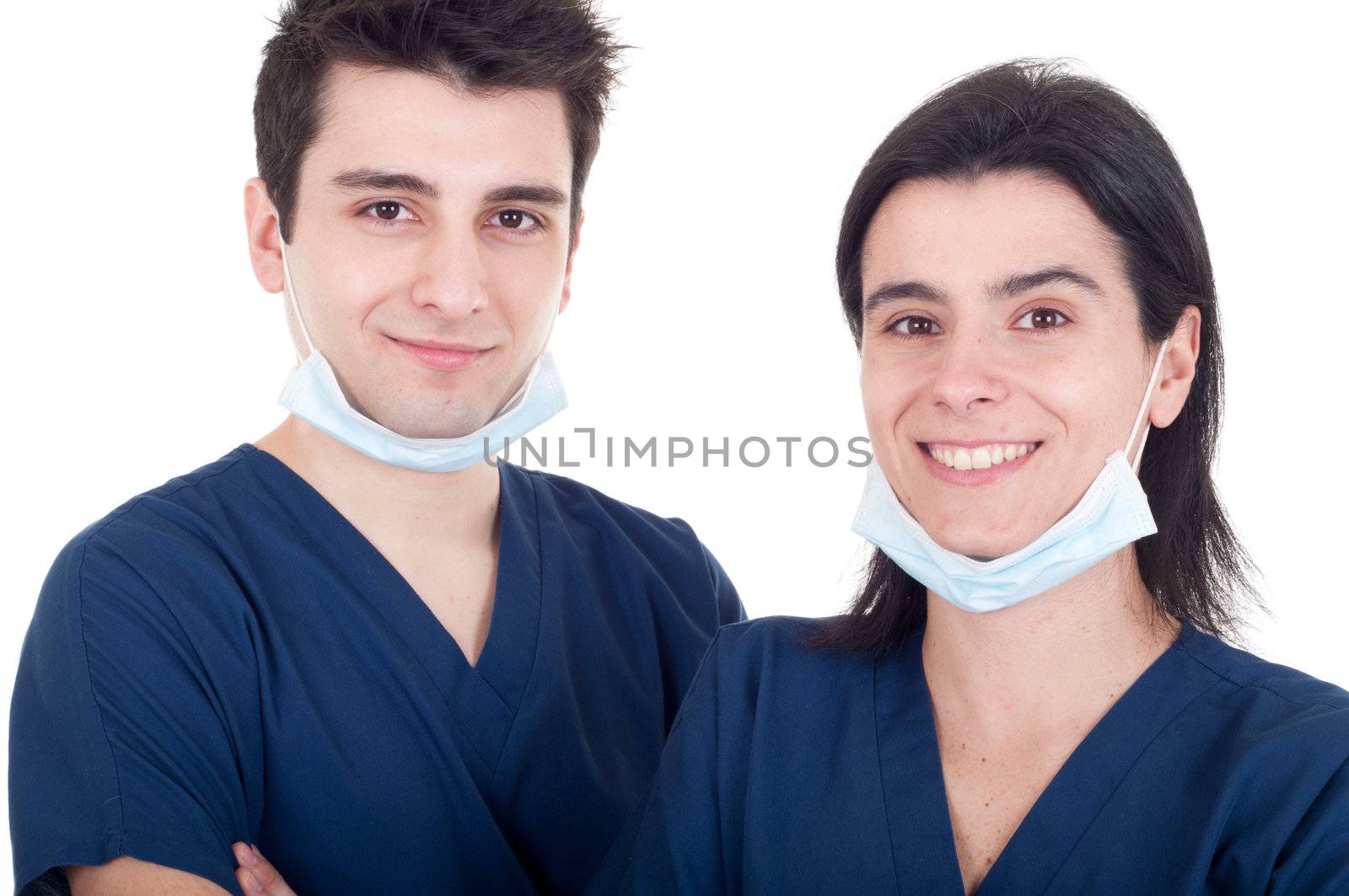 closeup portrait of a team of doctors, man and woman wearing mask and uniform isolated on white background