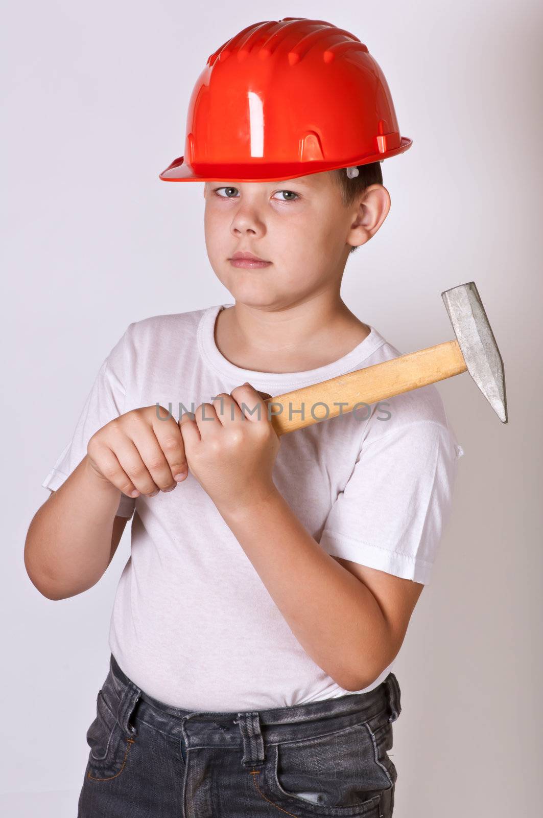 Portrait of a boy in a red protective helmet