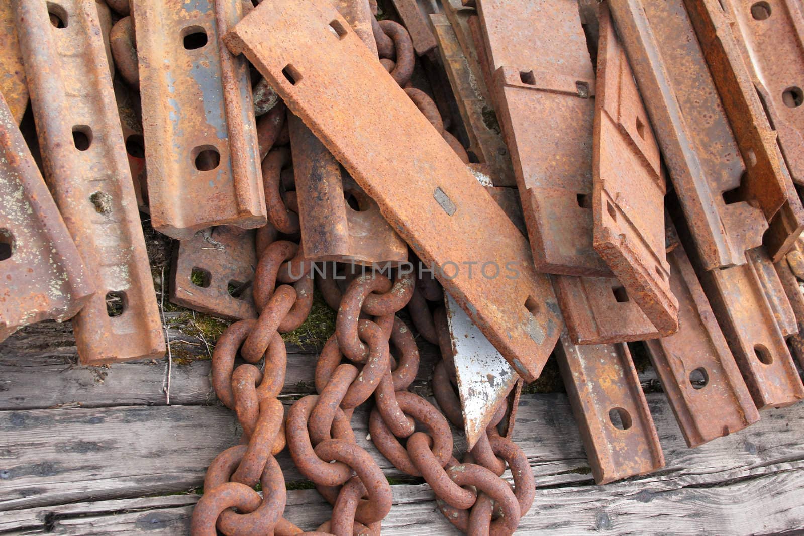 Old unused pieces of train tracks and metal chains