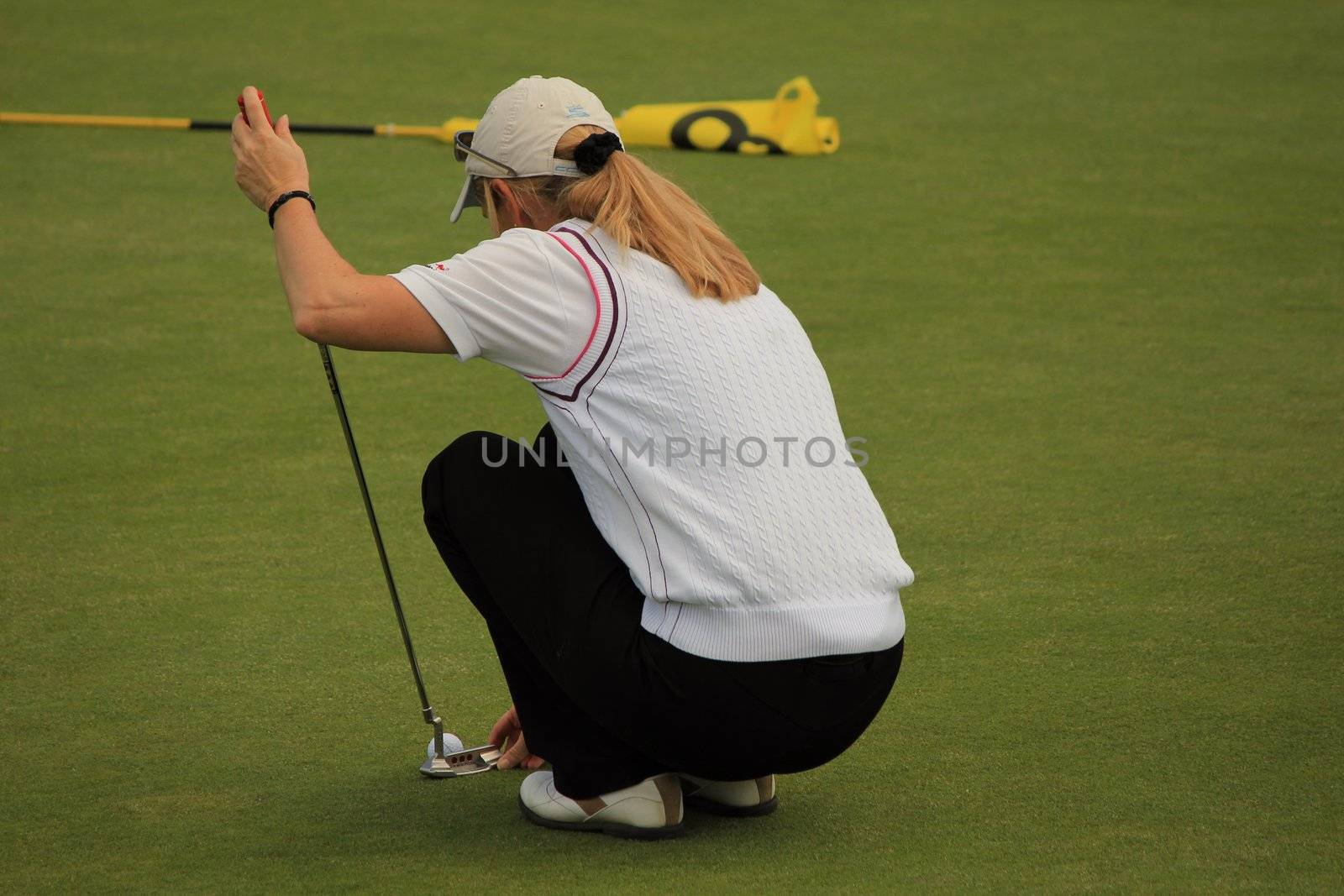 Golf player and grass green