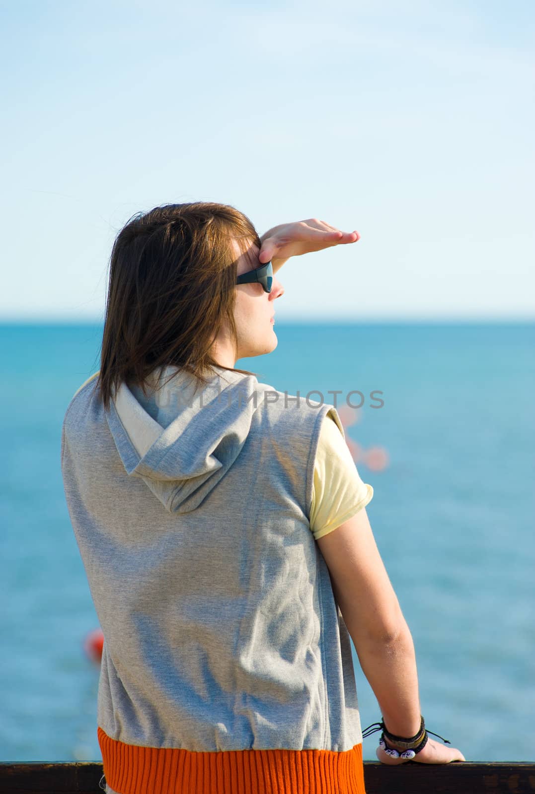 Teen looking out towards the horizon, a future concept