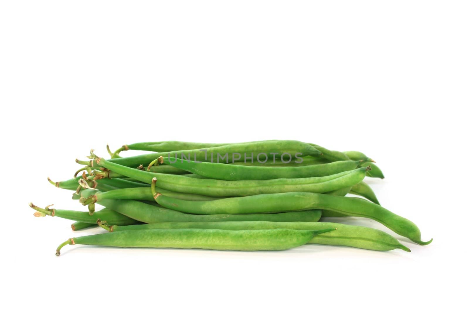 fresh green beans on a white background