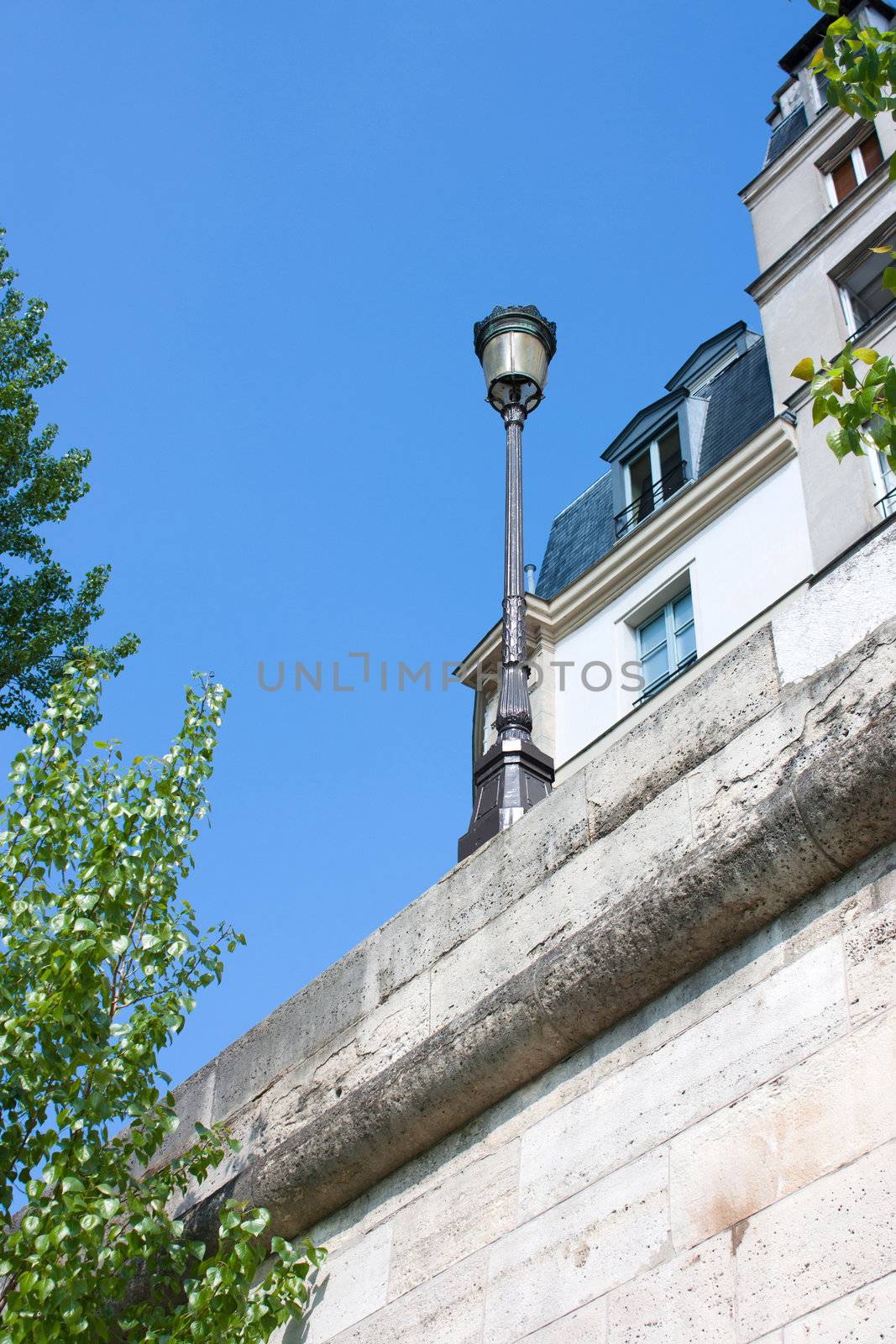 Closeup view of Ile Saint Louis in Paris, with streelight and typical buildings