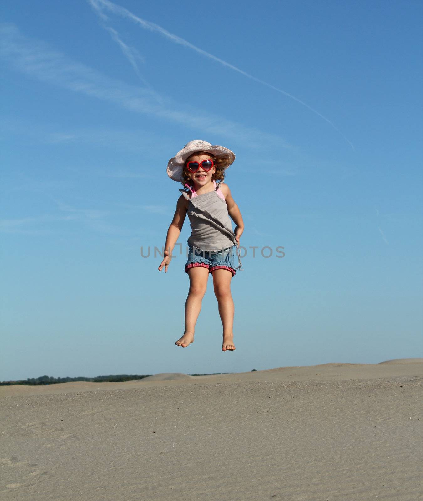 happy little girl high jump by goce