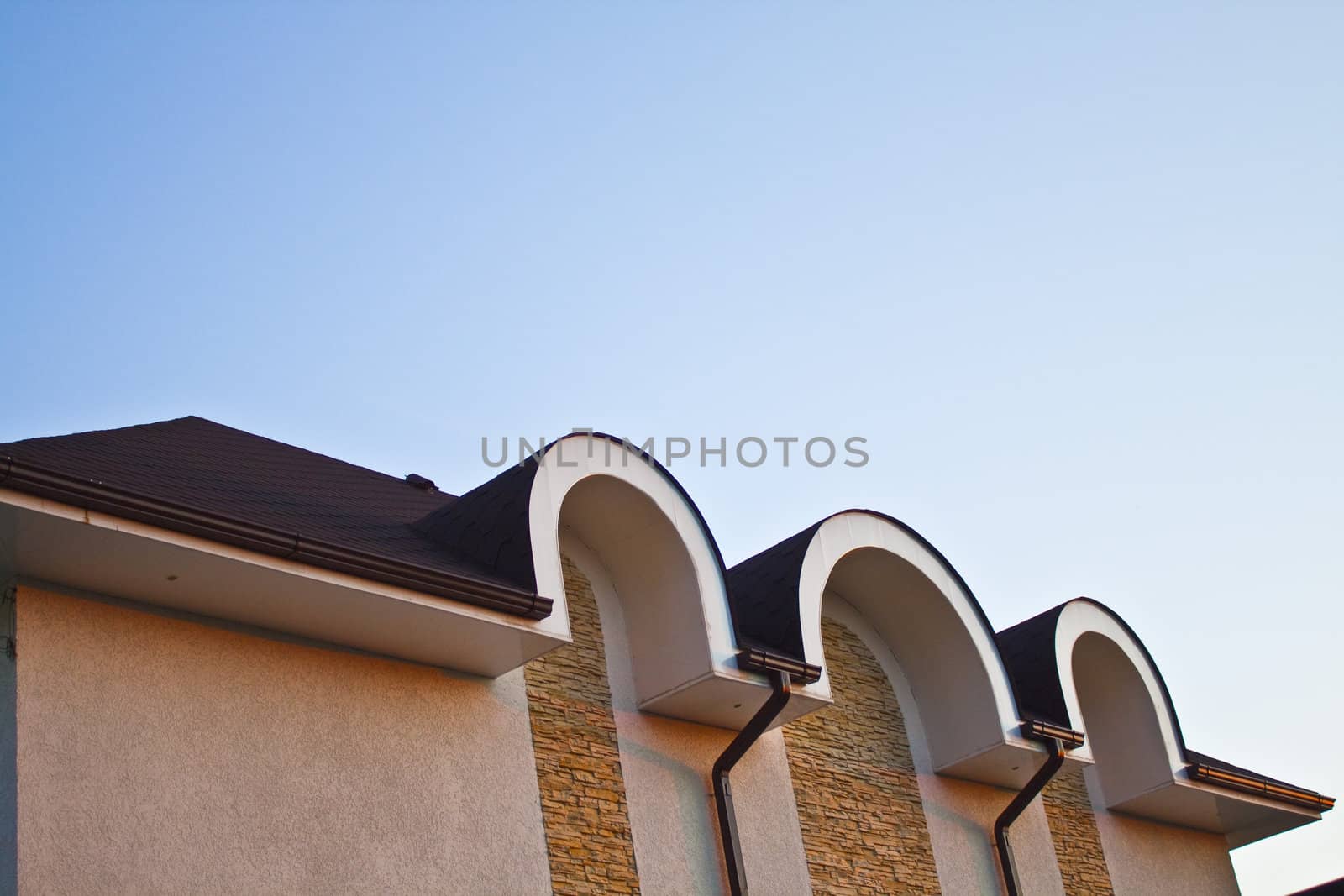 a group of townhouses - homes with bright blue sky background