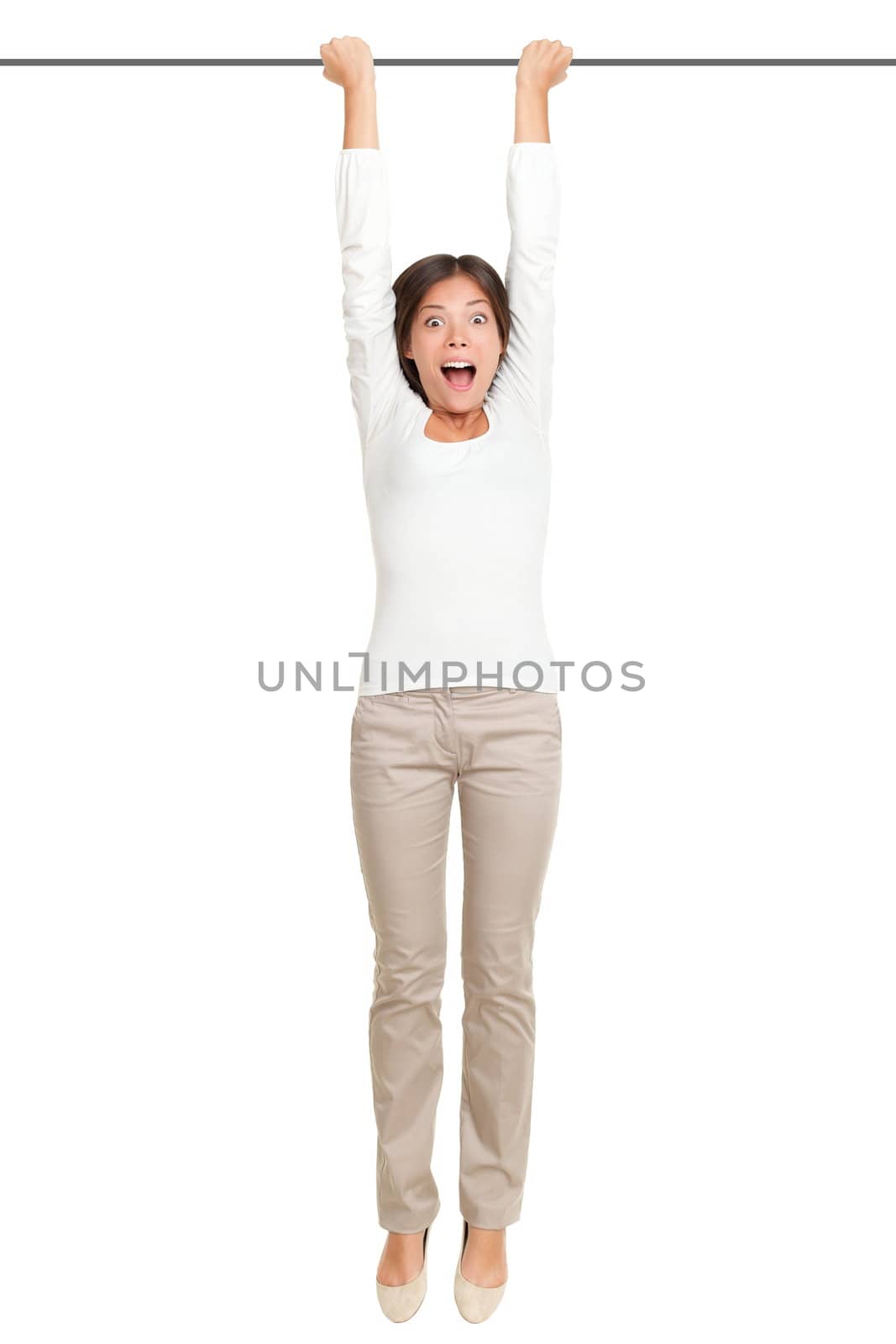 woman hanging with hands on a pole or bar. Funny image of shocked looking female model isolated on white background.