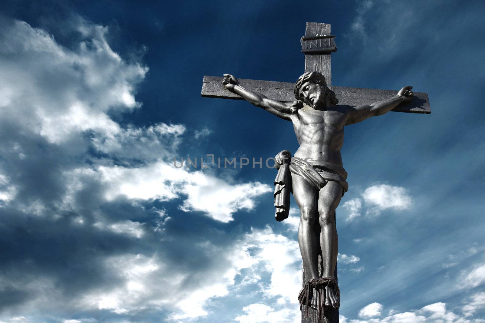 Illustration of the crucifixion of Jesus Christ with a stormy sky recalling the anger of God