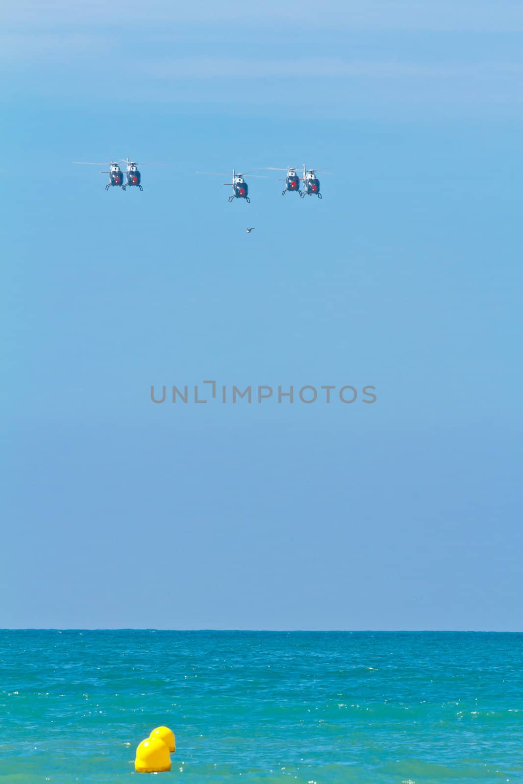 CADIZ, SPAIN-SEP 11: Helicopters of the Patrulla Aspa taking part in an exhibition on the 4th airshow of Cadiz on Sep 11, 2011, in Cadiz, Spain