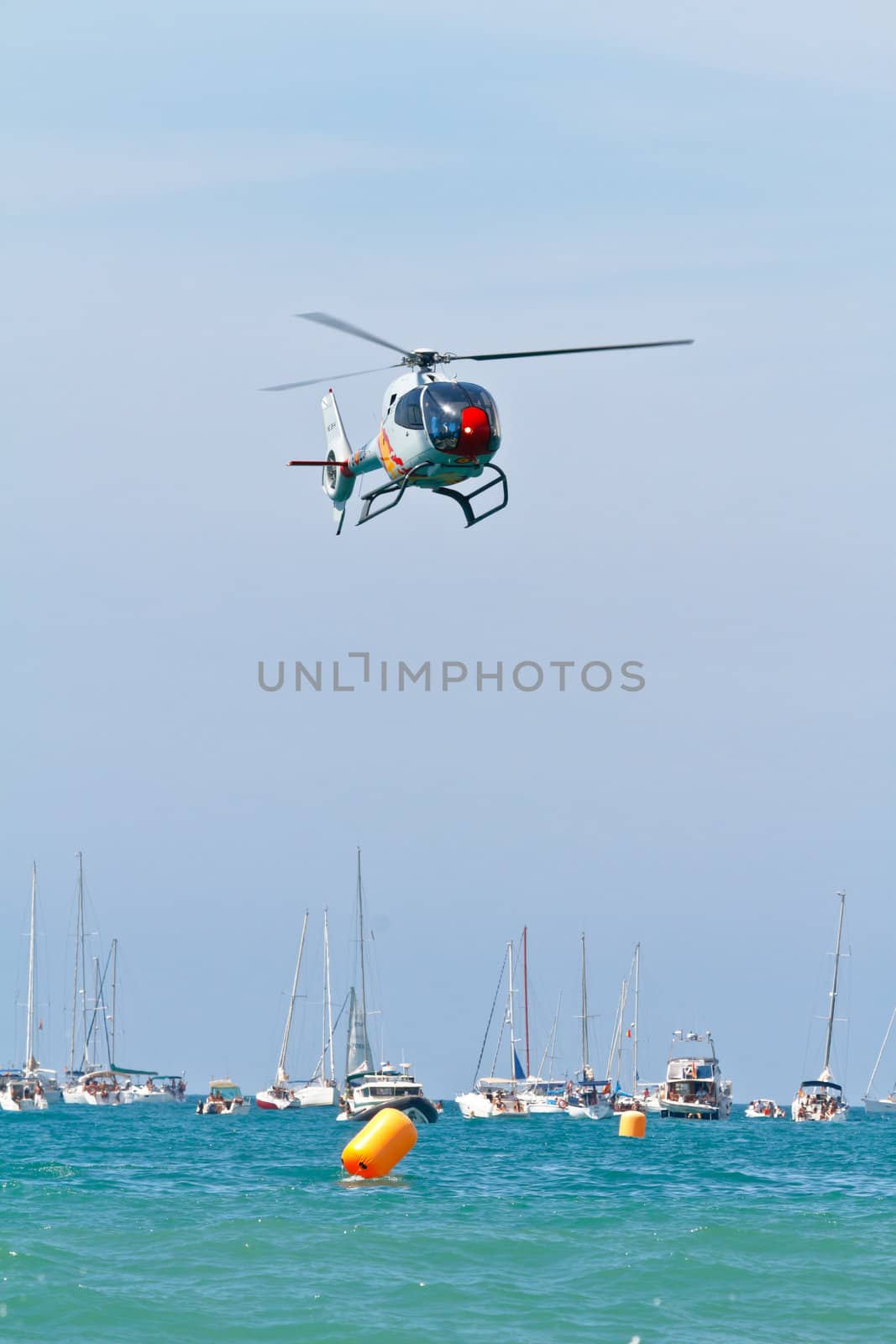 CADIZ, SPAIN-SEP 11: Helicopters of the Patrulla Aspa taking part in an exhibition on the 4th airshow of Cadiz on Sep 11, 2011, in Cadiz, Spain