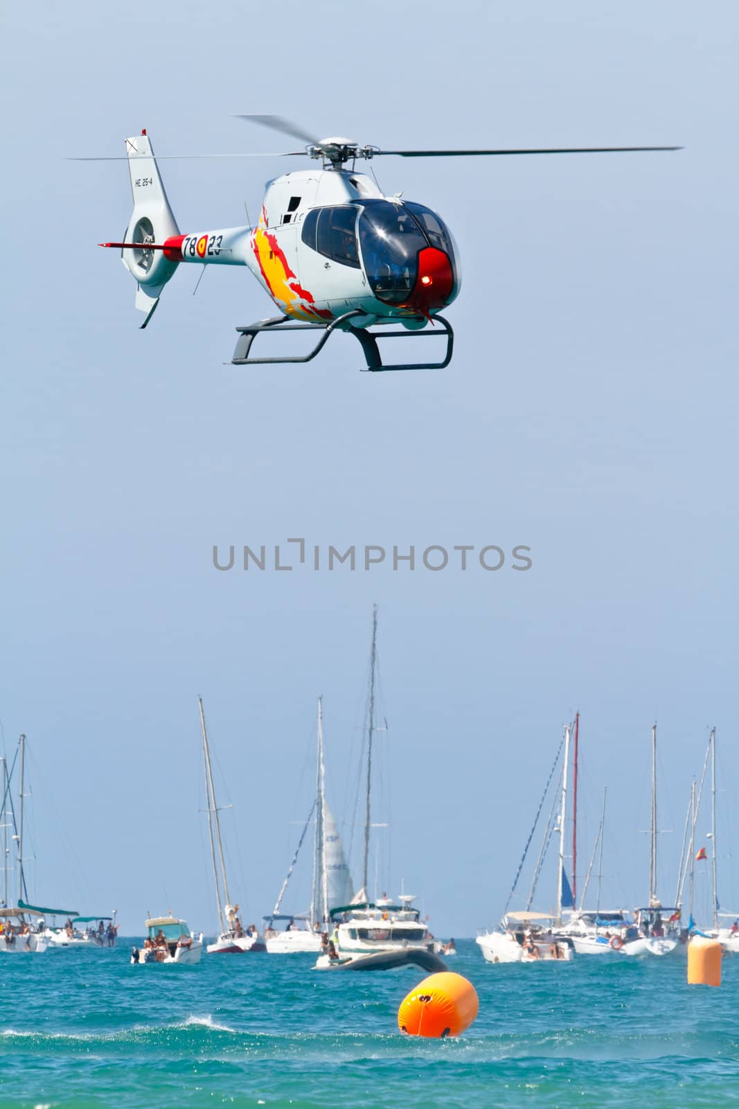 CADIZ, SPAIN-SEP 11: Helicopters of the Patrulla Aspa taking part in an exhibition on the 4th airshow of Cadiz on Sep 11, 2011, in Cadiz, Spain