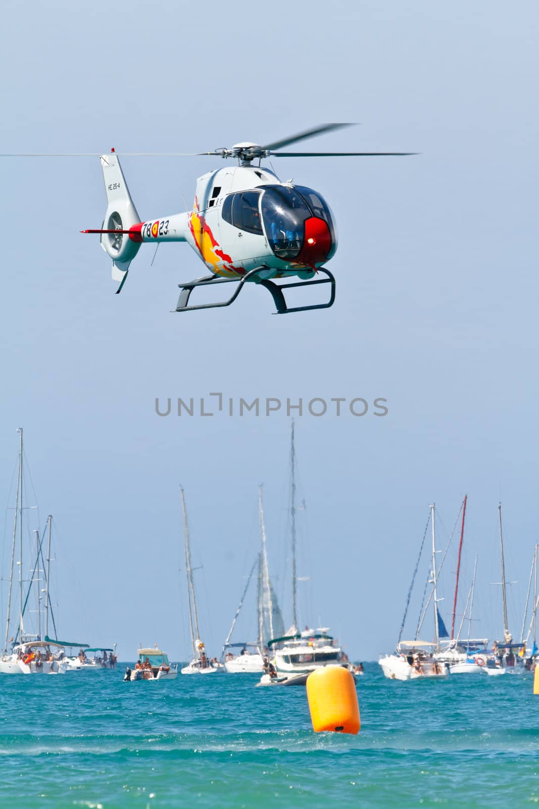 CADIZ, SPAIN-SEP 11: Helicopters of the Patrulla Aspa taking part in an exhibition on the 4th airshow of Cadiz on Sep 11, 2011, in Cadiz, Spain