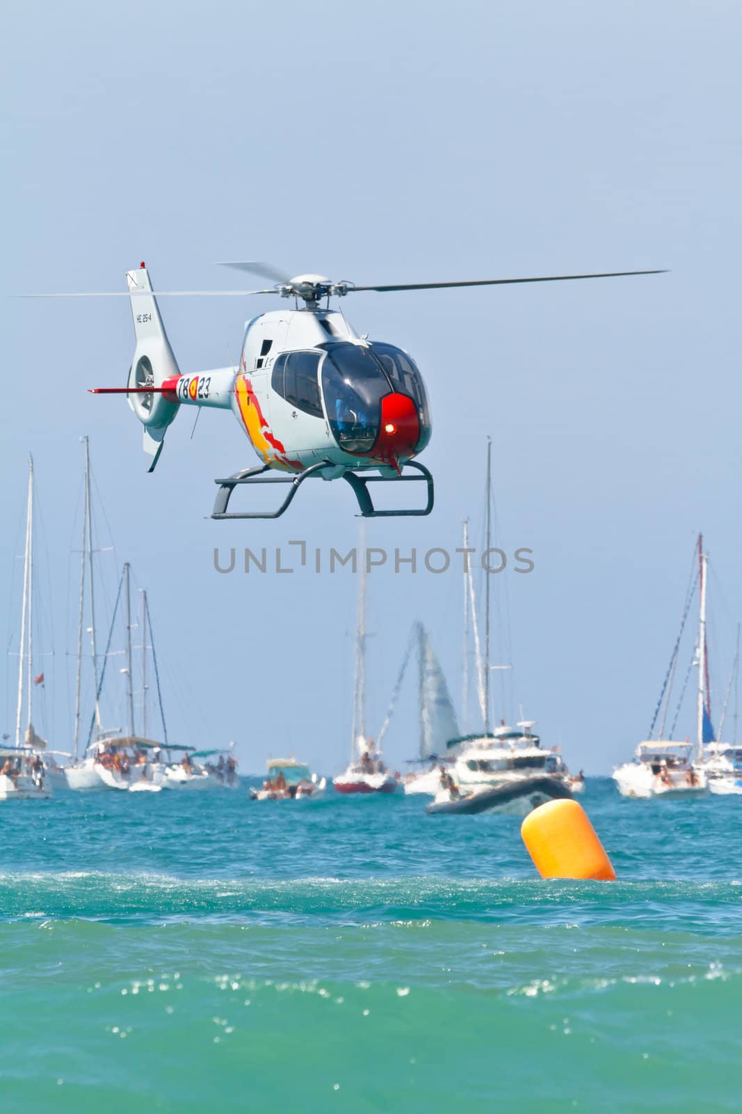 CADIZ, SPAIN-SEP 11: Helicopters of the Patrulla Aspa taking part in an exhibition on the 4th airshow of Cadiz on Sep 11, 2011, in Cadiz, Spain