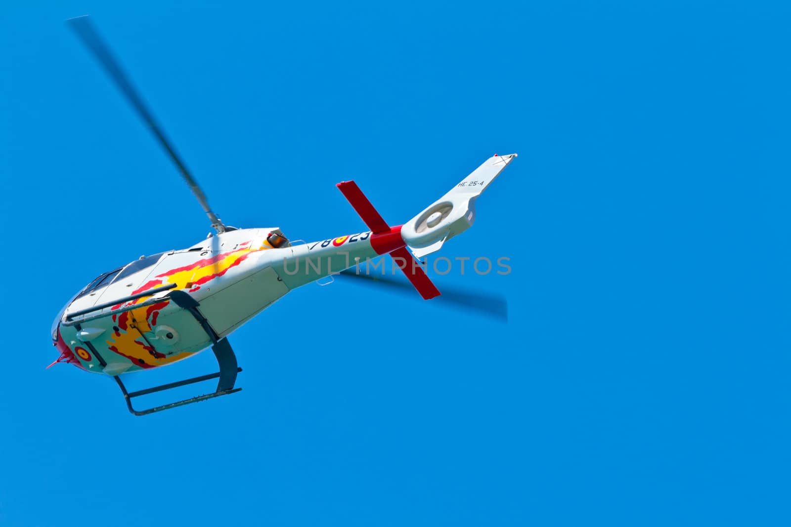 CADIZ, SPAIN-SEP 11: Helicopters of the Patrulla Aspa taking part in an exhibition on the 4th airshow of Cadiz on Sep 11, 2011, in Cadiz, Spain