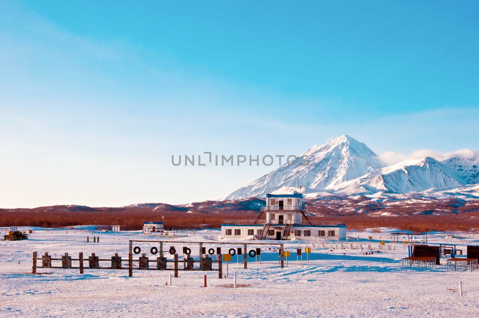 Military training base against a volcano in Russia