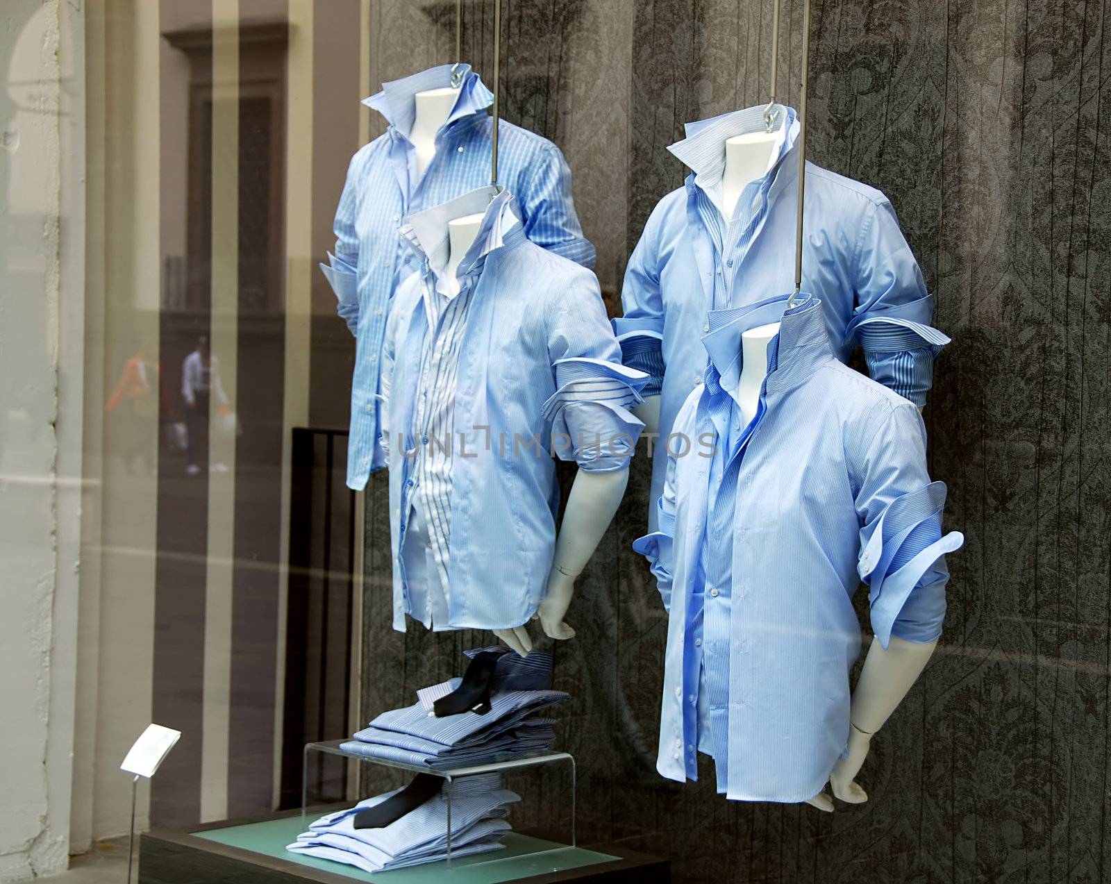 various  blue men's shirt in shop window