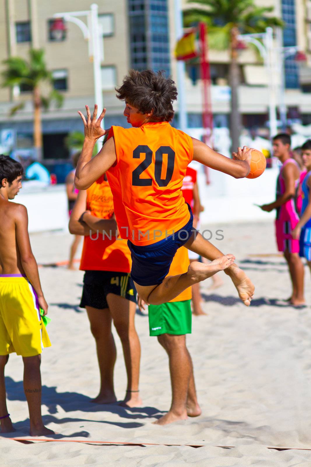 CADIZ, SPAIN - JULY 19: Unidentified players compete in a match between Autoescuela Barquin and CadizSur Seguros BMPY in the 19th league of beach handball of Cadiz on July 19, 2011 in Cadiz, Spain