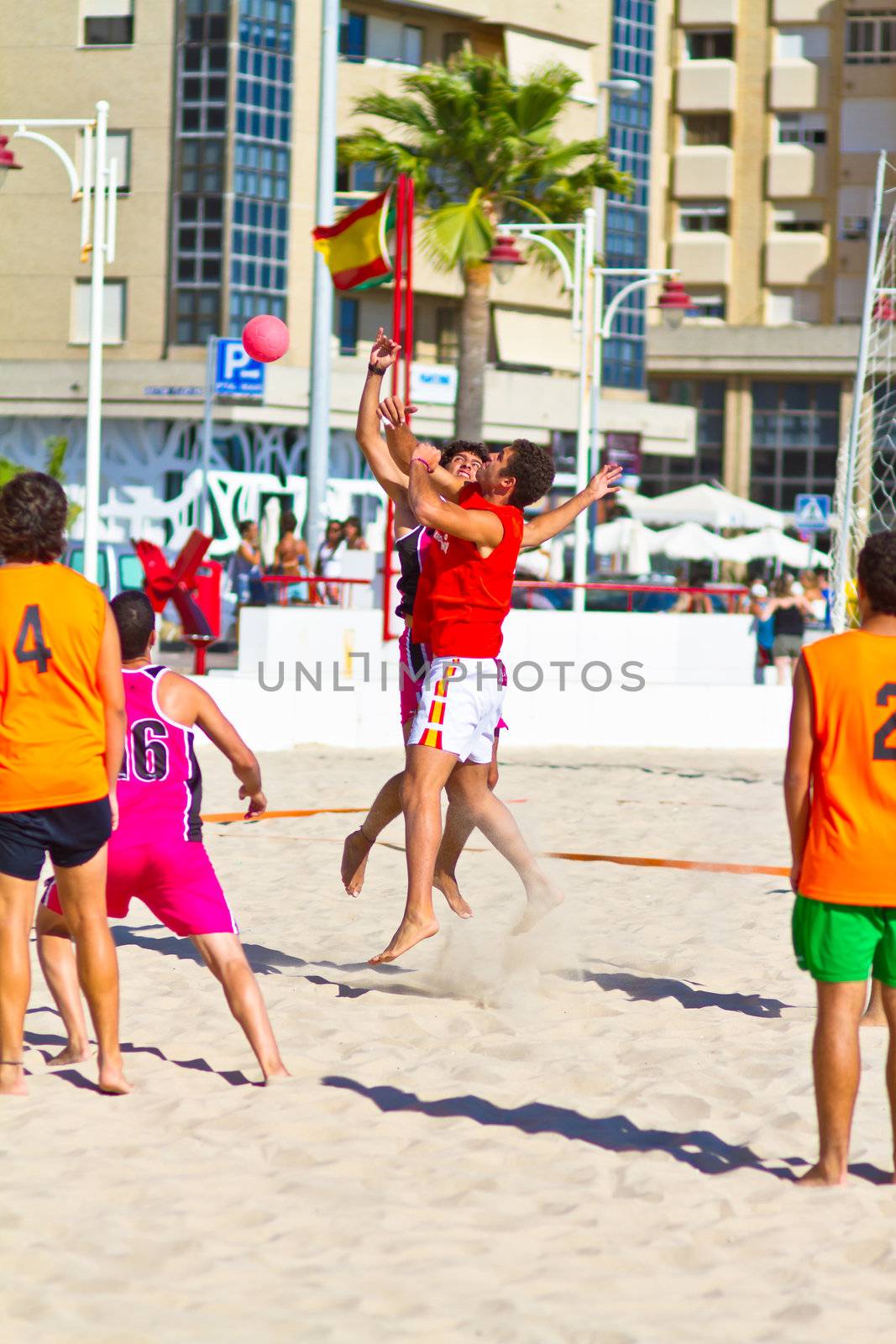 CADIZ, SPAIN - JULY 19: Unidentified players compete in a match between Autoescuela Barquin and CadizSur Seguros BMPY in the 19th league of beach handball of Cadiz on July 19, 2011 in Cadiz, Spain