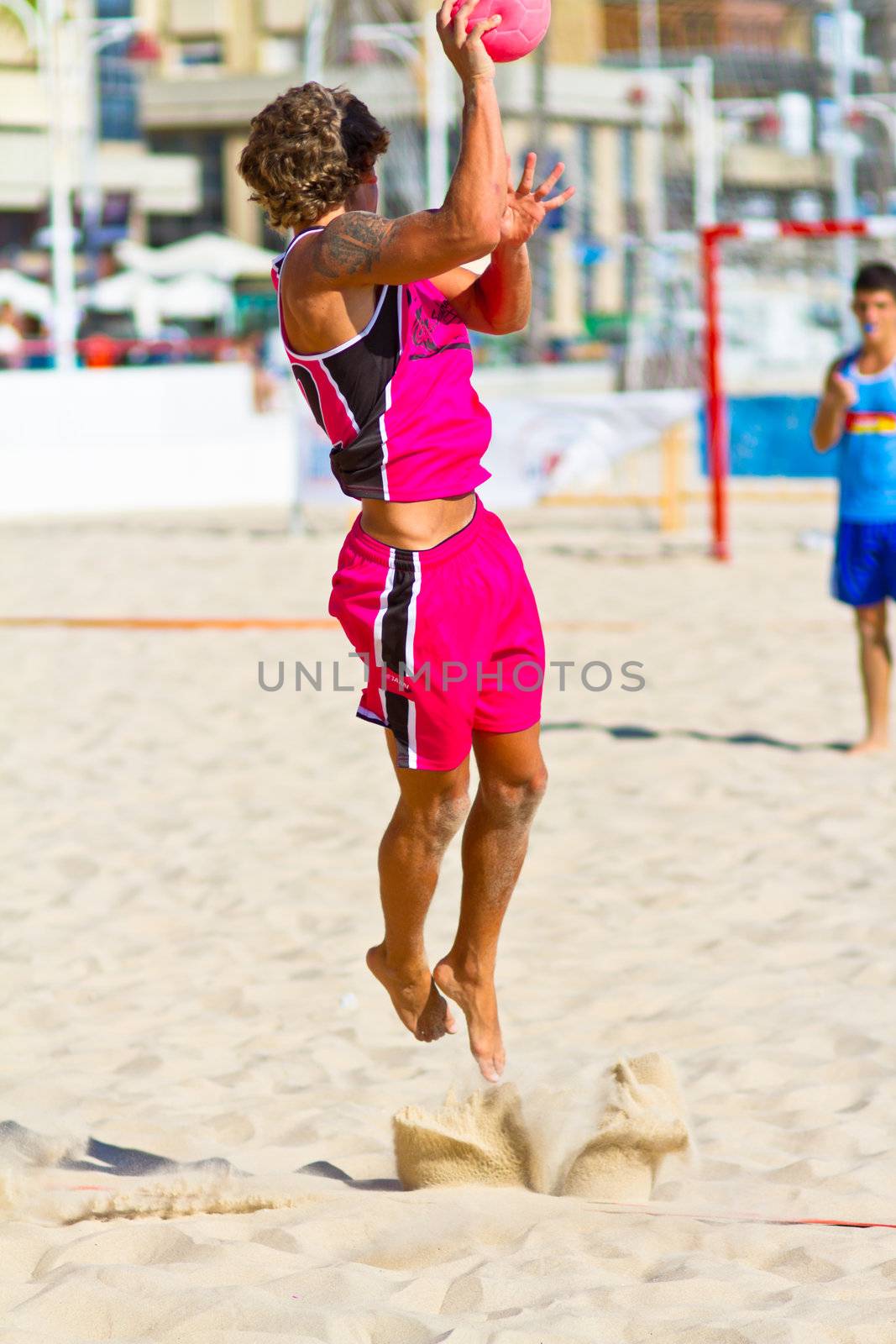 CADIZ, SPAIN - JULY 19: Unidentified players compete in a match between Autoescuela Barquin and CadizSur Seguros BMPY in the 19th league of beach handball of Cadiz on July 19, 2011 in Cadiz, Spain