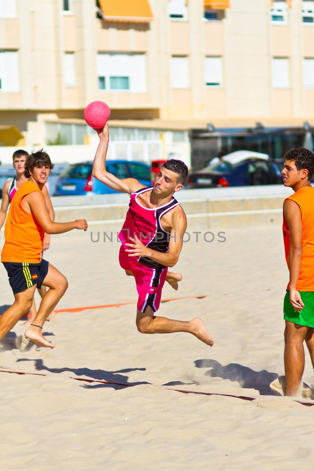 CADIZ, SPAIN - JULY 19: Unidentified players compete in a match between Autoescuela Barquin and CadizSur Seguros BMPY in the 19th league of beach handball of Cadiz on July 19, 2011 in Cadiz, Spain