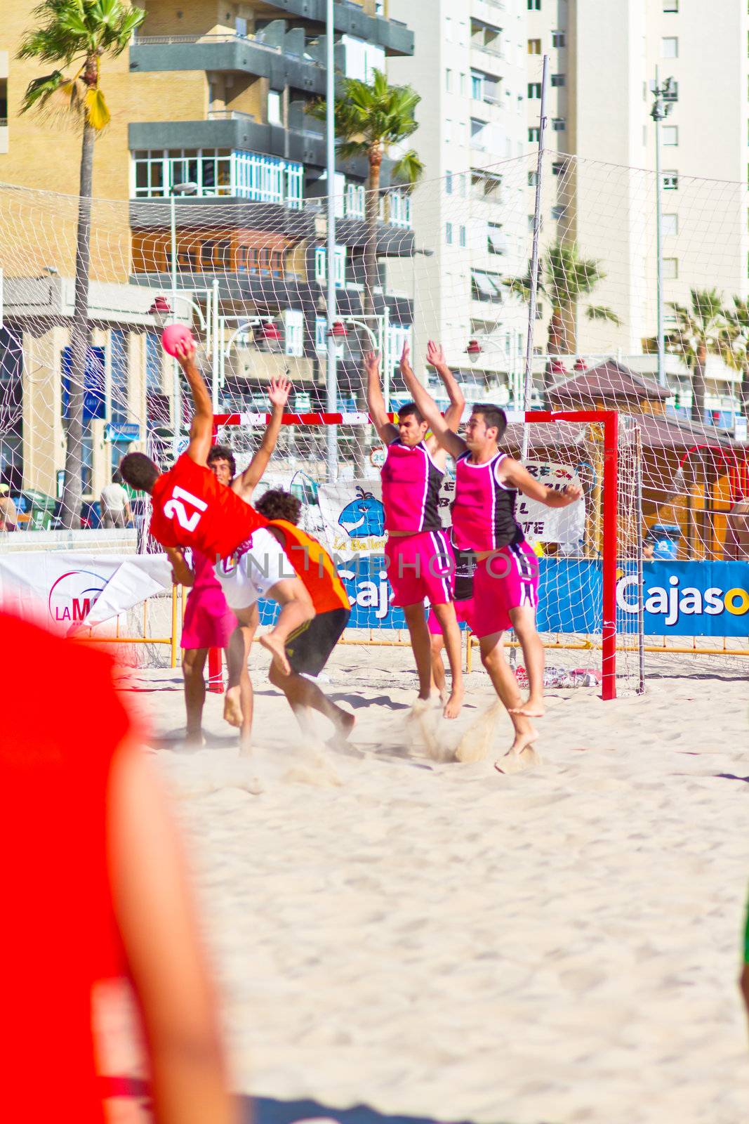 CADIZ, SPAIN - JULY 19: Unidentified players compete in a match between Autoescuela Barquin and CadizSur Seguros BMPY in the 19th league of beach handball of Cadiz on July 19, 2011 in Cadiz, Spain