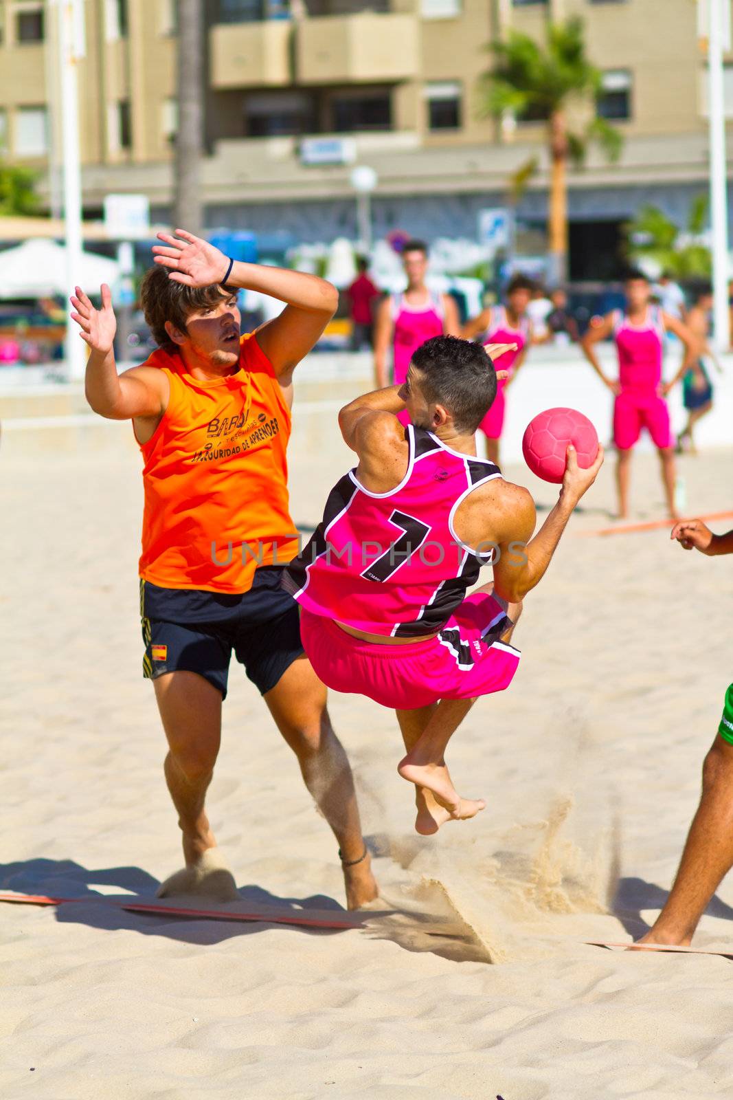 CADIZ, SPAIN - JULY 19: Unidentified players compete in a match between Autoescuela Barquin and CadizSur Seguros BMPY in the 19th league of beach handball of Cadiz on July 19, 2011 in Cadiz, Spain