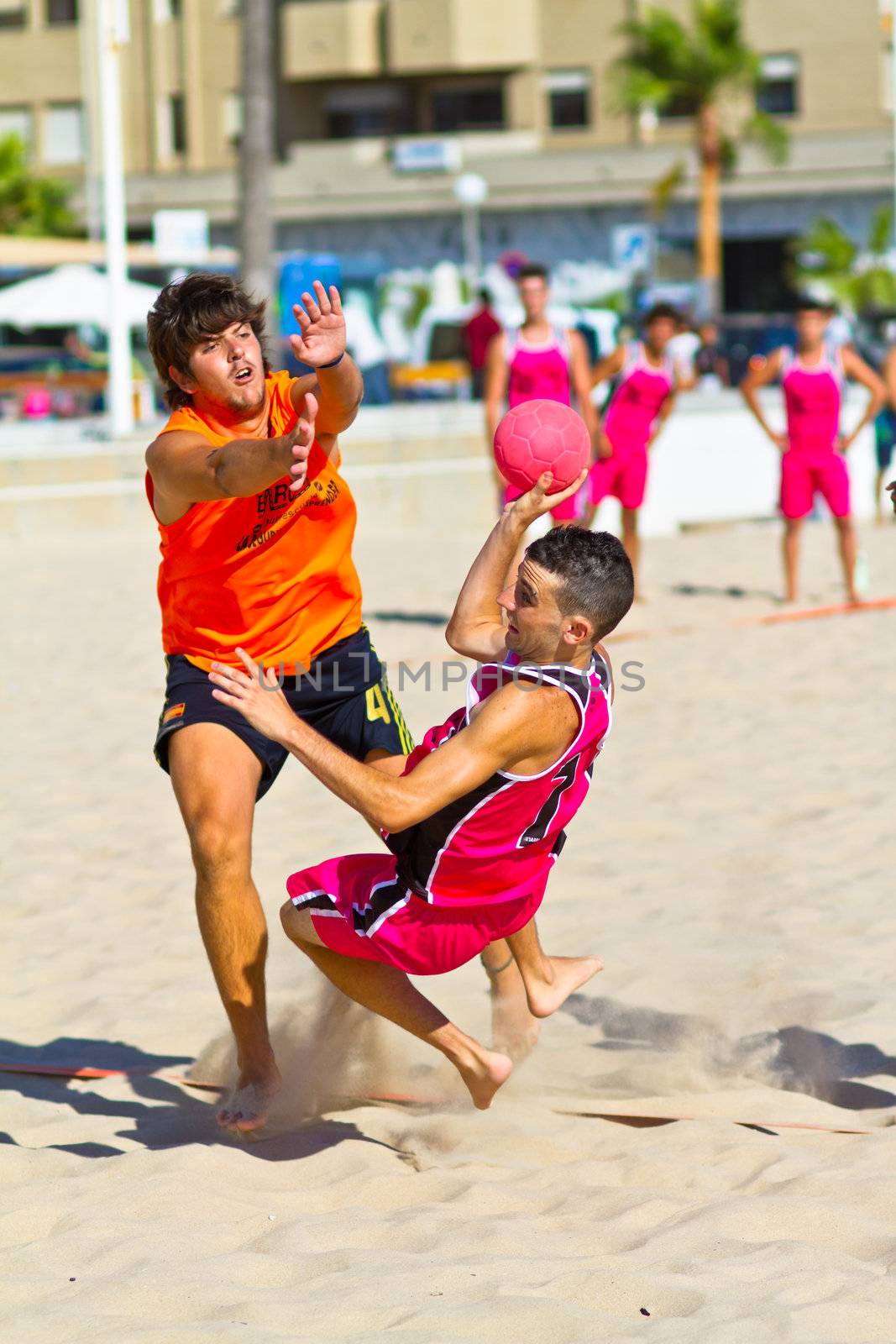CADIZ, SPAIN - JULY 19: Unidentified players compete in a match between Autoescuela Barquin and CadizSur Seguros BMPY in the 19th league of beach handball of Cadiz on July 19, 2011 in Cadiz, Spain