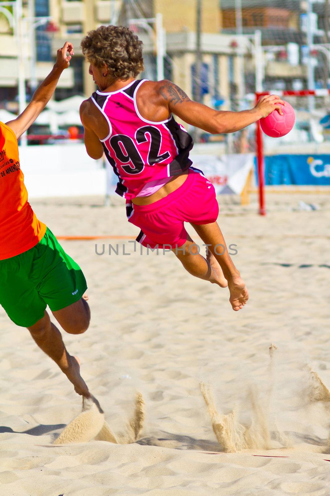 CADIZ, SPAIN - JULY 19: Unidentified players compete in a match between Autoescuela Barquin and CadizSur Seguros BMPY in the 19th league of beach handball of Cadiz on July 19, 2011 in Cadiz, Spain