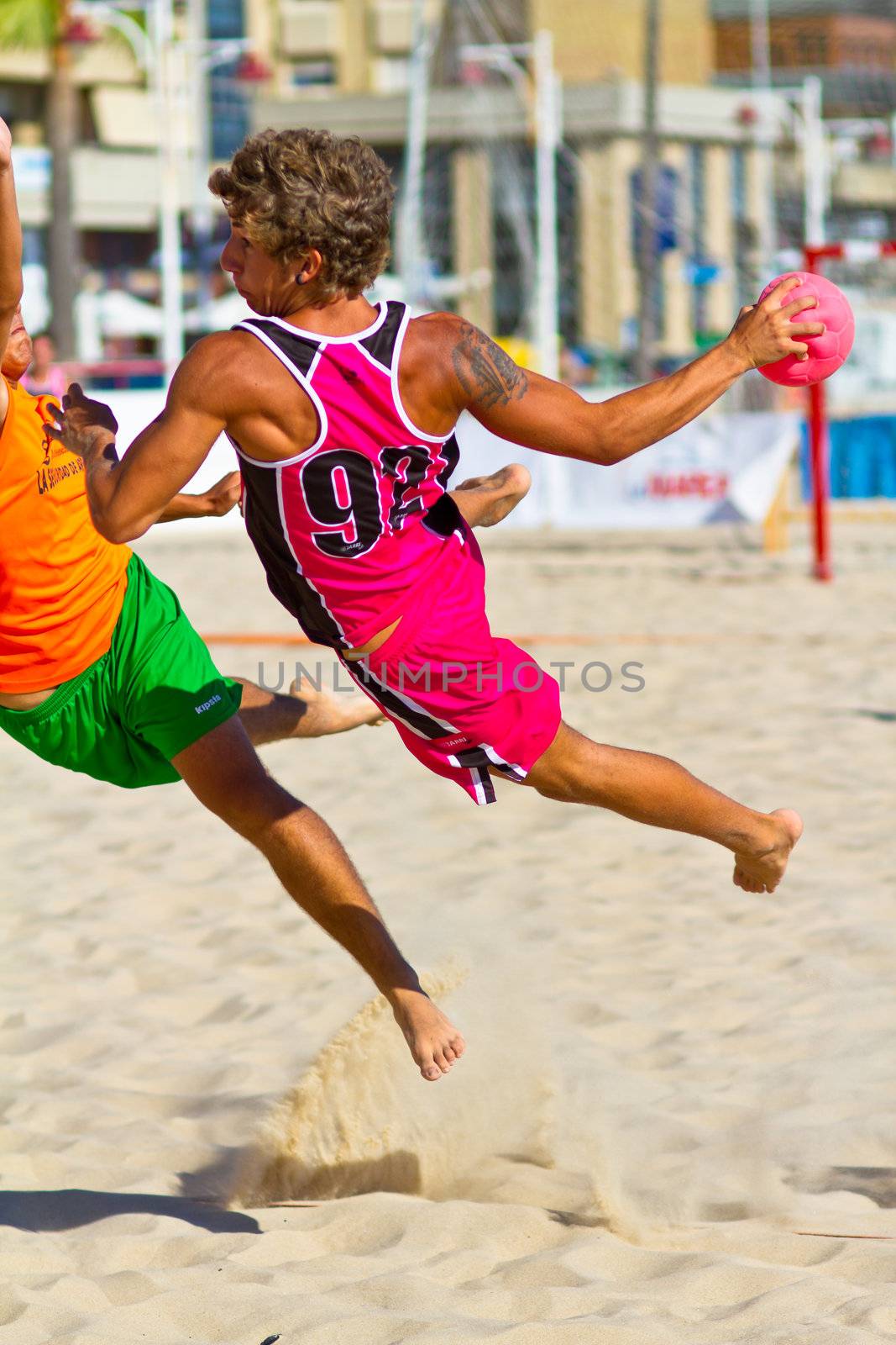 CADIZ, SPAIN - JULY 19: Unidentified players compete in a match between Autoescuela Barquin and CadizSur Seguros BMPY in the 19th league of beach handball of Cadiz on July 19, 2011 in Cadiz, Spain
