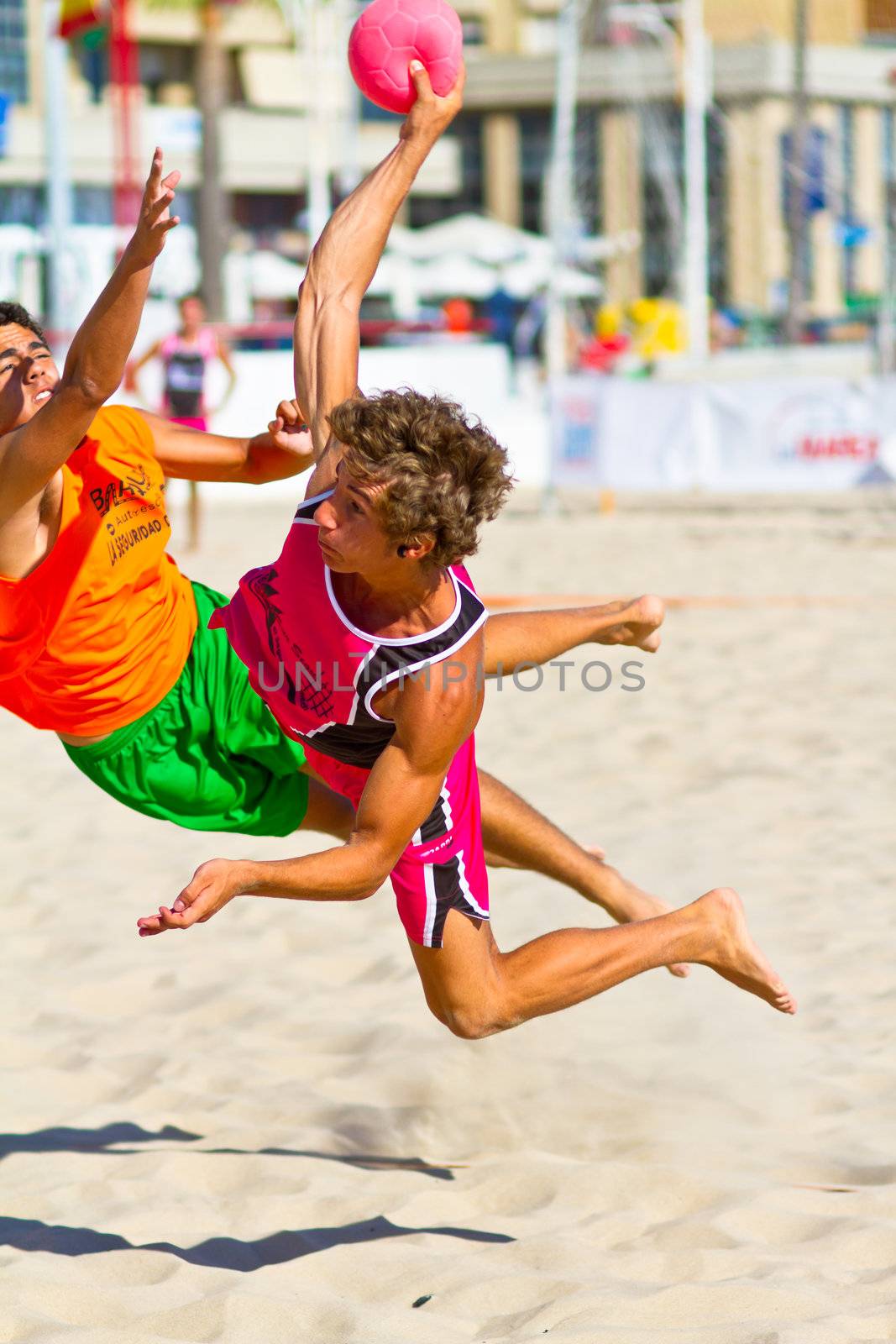 CADIZ, SPAIN - JULY 19: Unidentified players compete in a match between Autoescuela Barquin and CadizSur Seguros BMPY in the 19th league of beach handball of Cadiz on July 19, 2011 in Cadiz, Spain