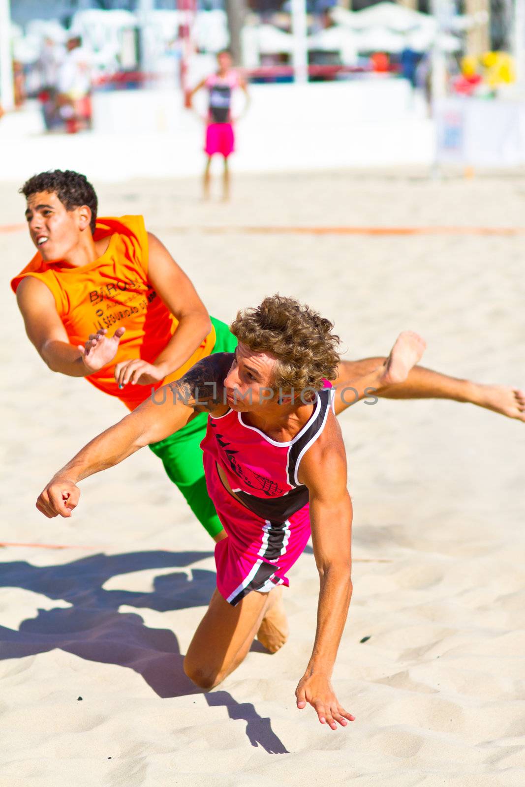 CADIZ, SPAIN - JULY 19: Unidentified players compete in a match between Autoescuela Barquin and CadizSur Seguros BMPY in the 19th league of beach handball of Cadiz on July 19, 2011 in Cadiz, Spain
